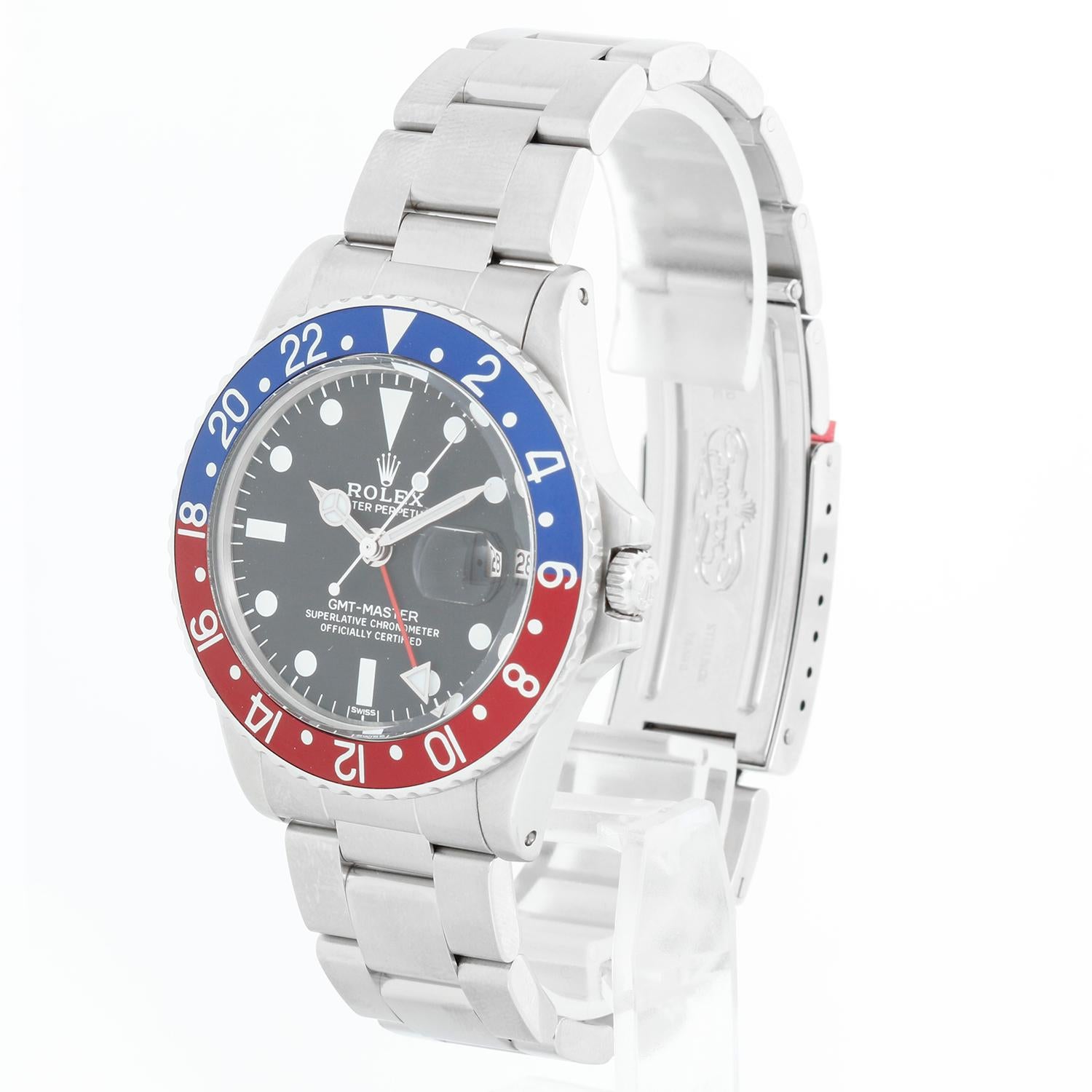 Reloj de caballero Rolex GMT-Master Vintage 1675 de acero inoxidable - cuerda automática. Caja de acero inoxidable, bisel giratorio con inserción roja y azul ( Pepsi )  (40 mm). Esfera negra. Brazalete Rolex Oyster de acero inoxidable . Seminuevo