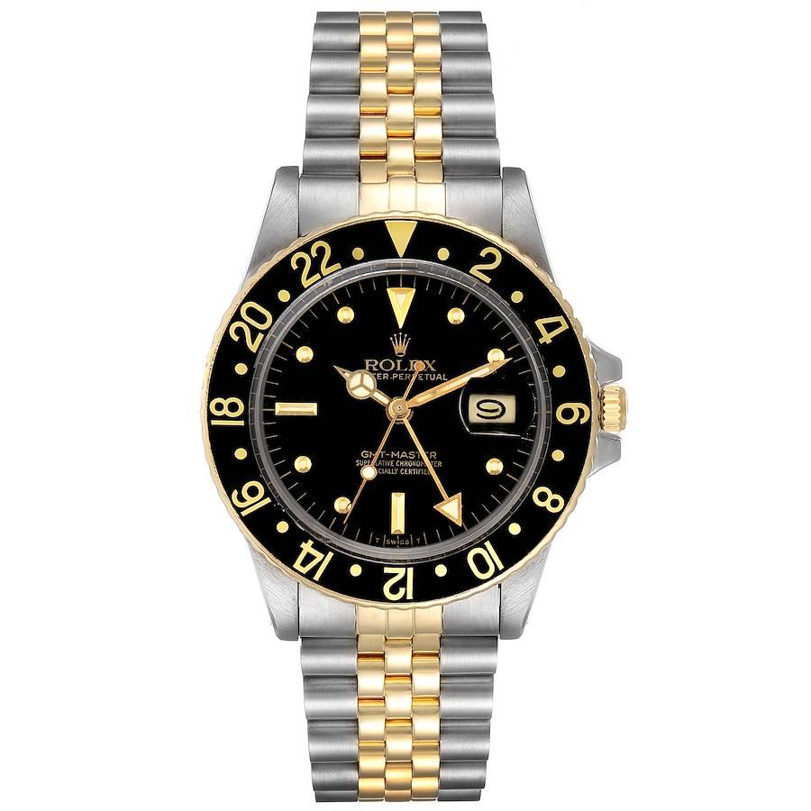 Rolex GMT Master Steel Yellow Gold Black Dial Vintage Mens Watch 16753. Officially certified chronometer self-winding movement. Stainless steel case 40.0 mm in diameter. Rolex logo on a crown. 18k yellow gold bidirectional rotating bezel with a