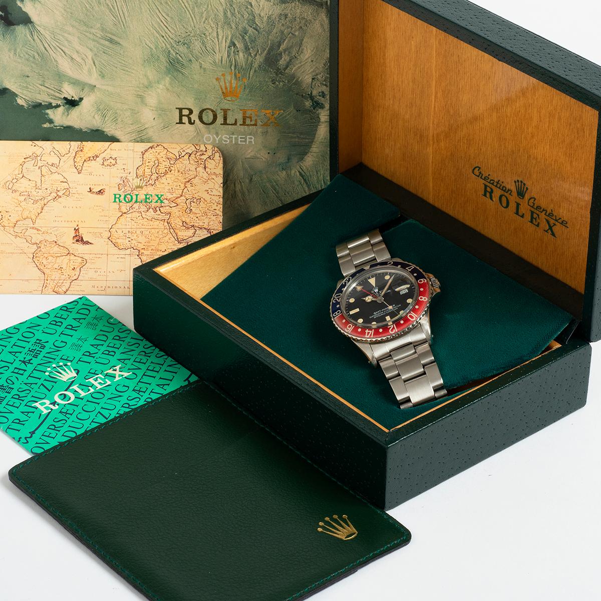 Our vintage and rare Rolex GMT Master is a transitional reference, 16750, and is a very attractive example; with original and coeval patination to the matte tritium dial and hands, gently faded red/ blue pepsi bezel insert and date matching serial