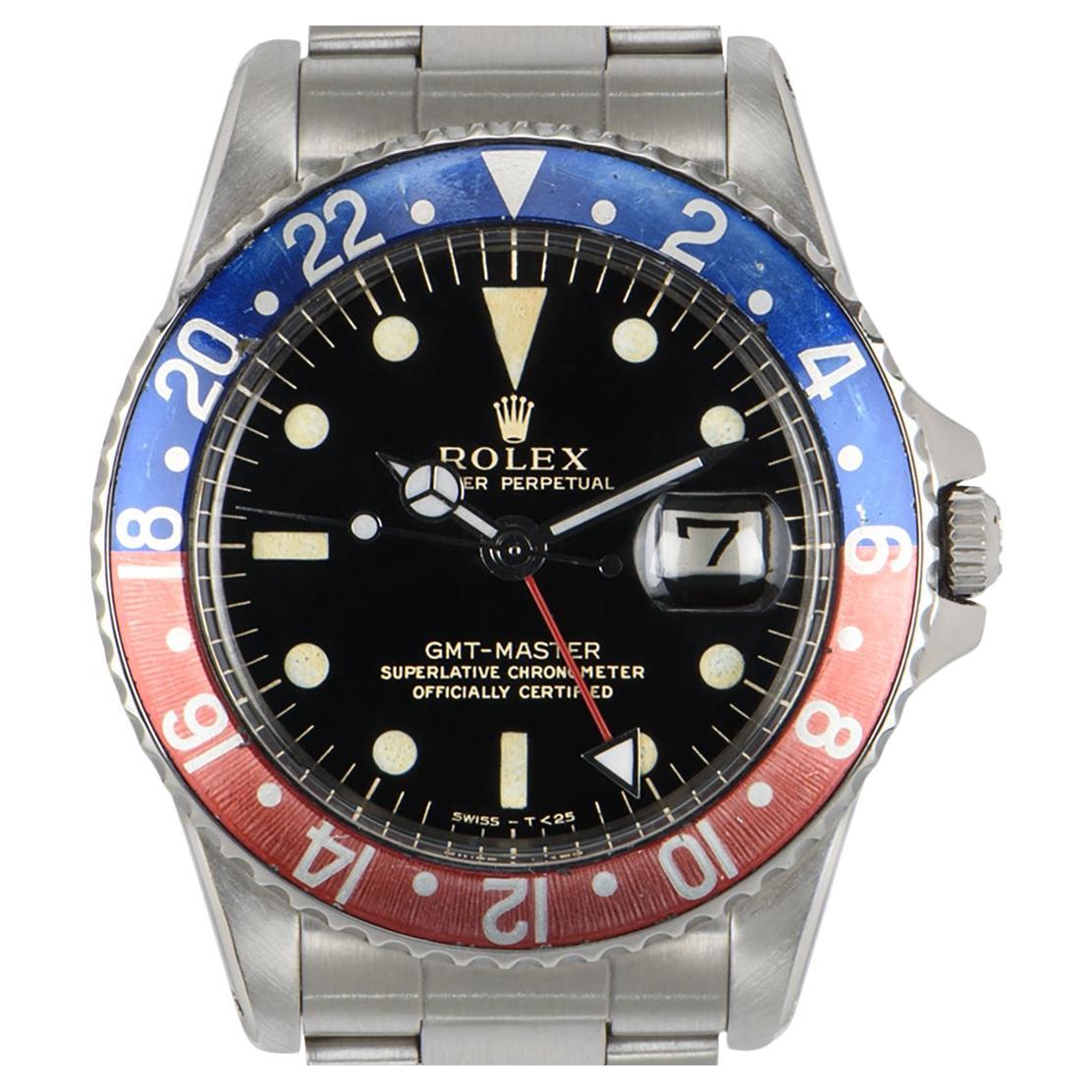 A Stainless Steel Oyster Perpetual GMT-Master Vintage Men's Wristwatch, black gilt dial with hour markers, date at 3 0'clock, a stainless steel bi-directional rotating bezel with a red and blue 