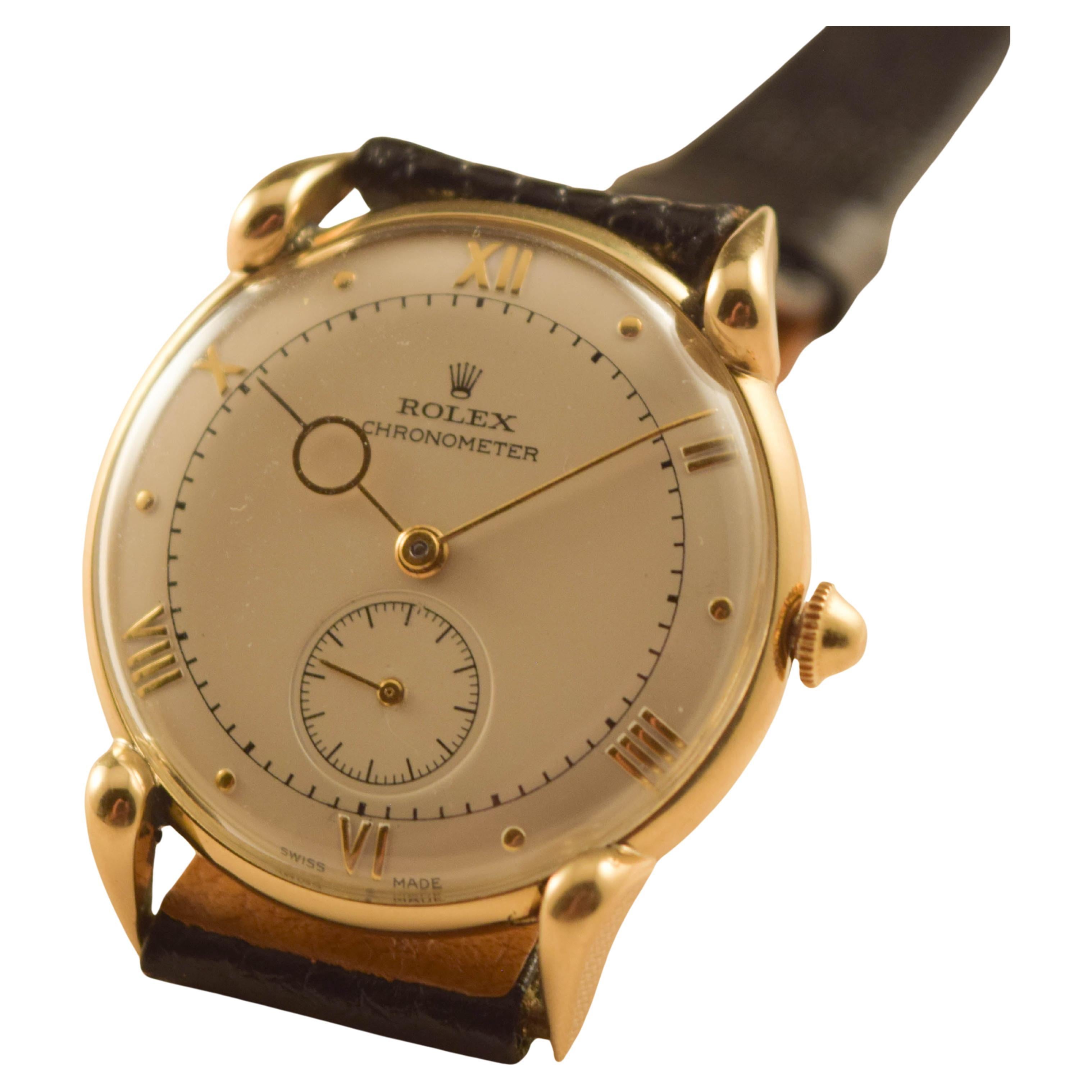 Rolex Vintage highly  important example.
 Solid 18 k cased watch with the rarest hands.
Unusual beautiful  lugs.
Sometimes it is called Grasshopper for this case

Dial is signed Rolex Chronometer  Rolex crown.
Raised gold Roman numerals  and