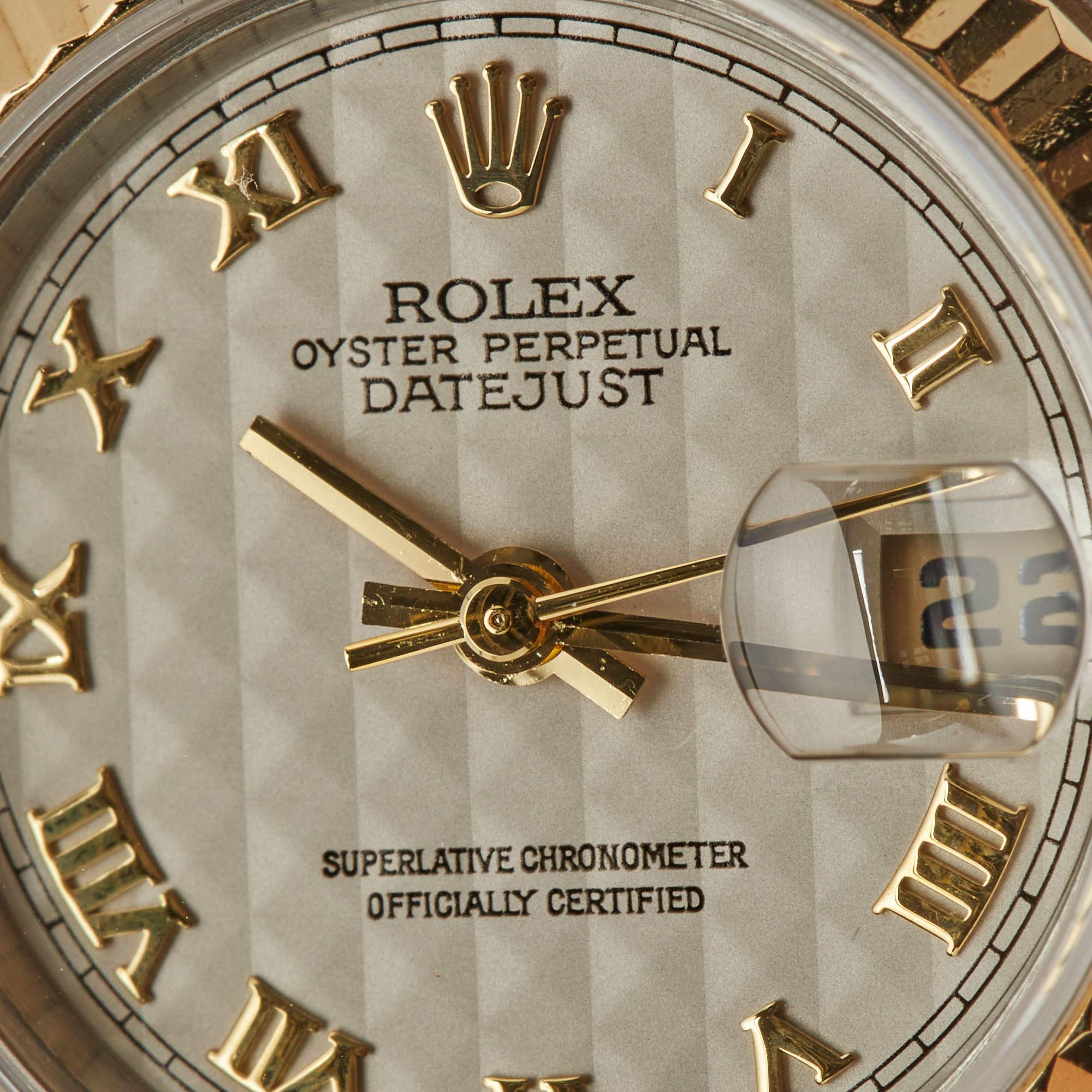 This beautiful Rolex Datejust for women will be a fine investment. Crafted using stainless steel and 18k yellow gold, the automatic watch features an ivory dial set with Roman numeral hour markers, a date window, and three hands. Iconic,