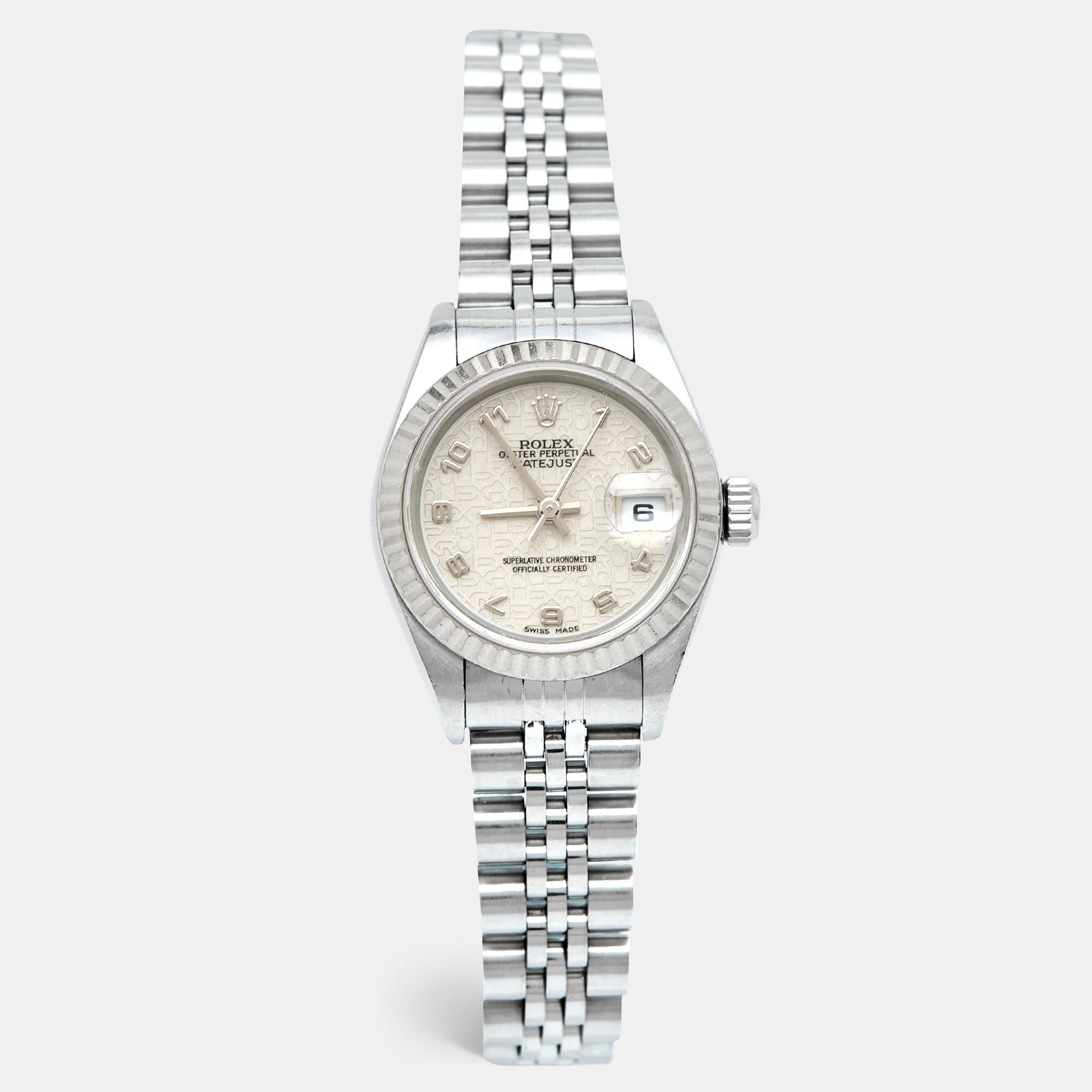 Crafted with meticulous attention to detail, the Rolex watch exudes timeless elegance. Its lustrous 18k white gold and stainless steel construction boasts durability and style. The ivory dial, adorned with luminous hour markers and hands, offers