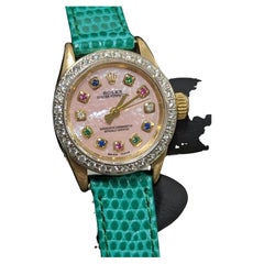 Rolex Ladies 18k Gold Oyster Perpetual Pink MOP Rainbow Dial Diamond Bezel Watch