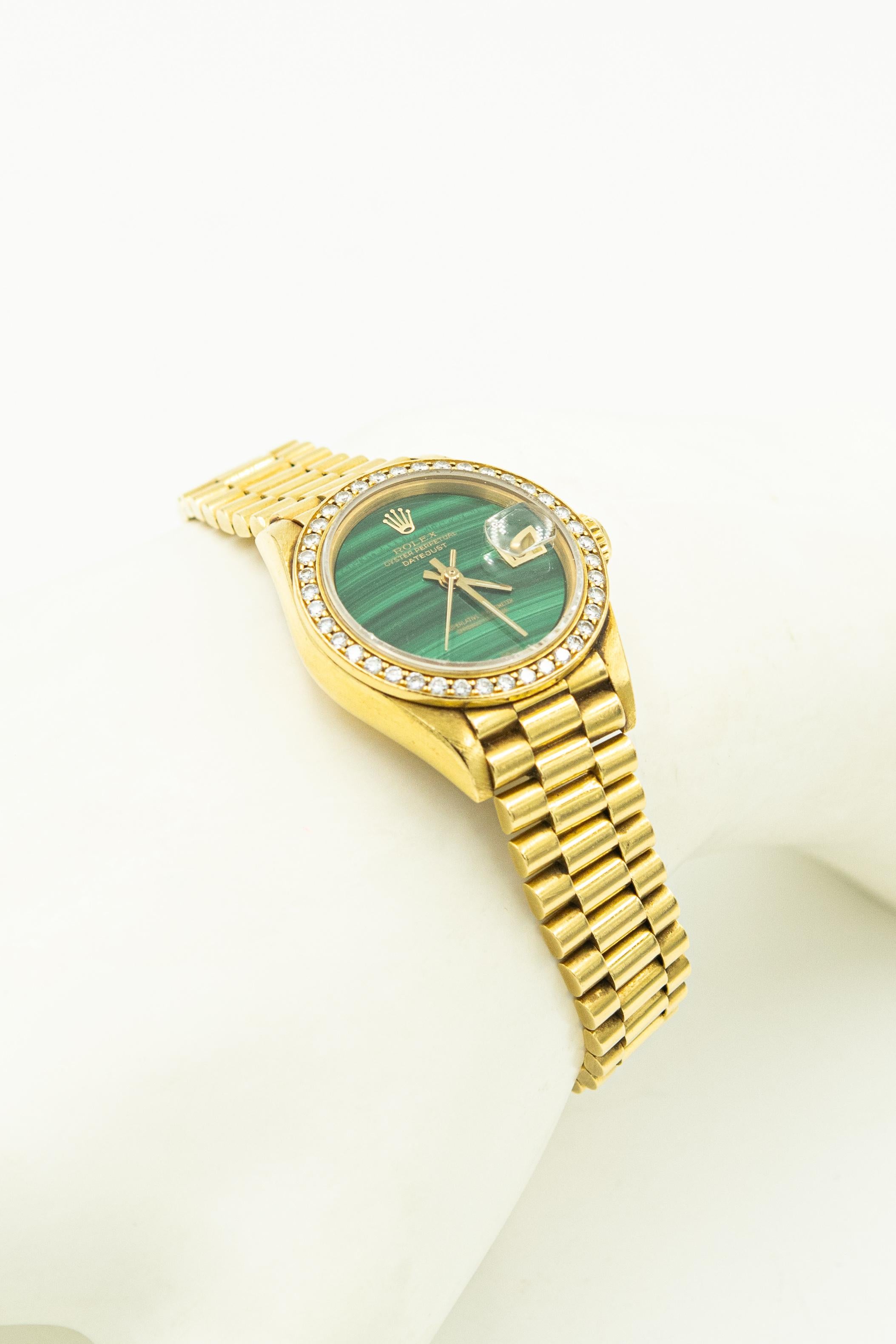 Rolex Ladies 18k Datejust Watch Reference 69178
Serial # R441.261. Malachite Dial 18k and Diamond Bezel with 40 fine white diamonds. 
18k Yellow Gold with 18k Yellow Gold President Bracelet. 
Automatic self-winding, 26mm deployment clasp.
Working
