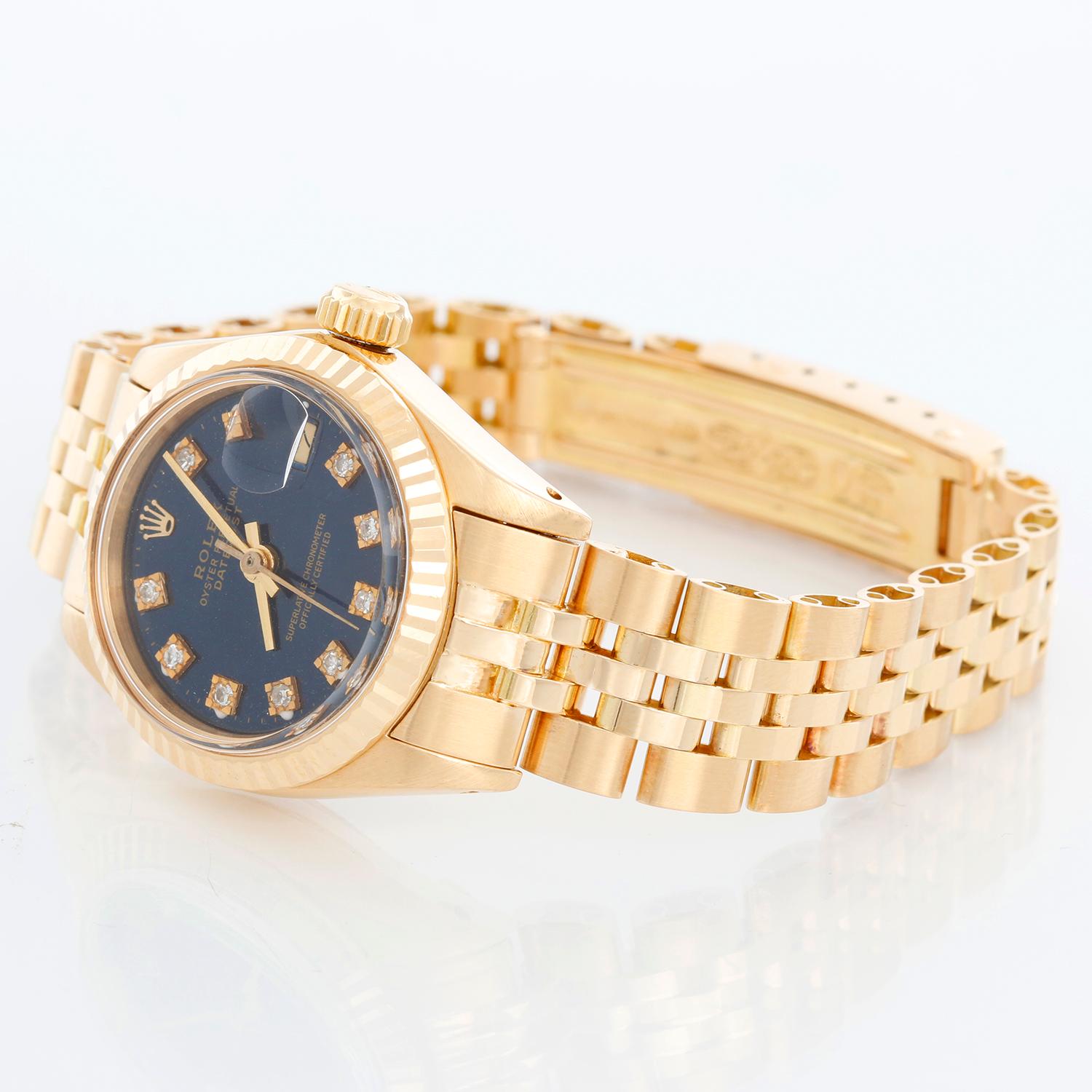 Rolex Ladies 18k Yellow Gold Watch  6917 - Automatic winding. 18k yellow gold case with fluted bezel  (26mm diameter). Custom  blue  diamond dial. 18k yellow gold jubilee bracelet. Pre-owned with box and books.