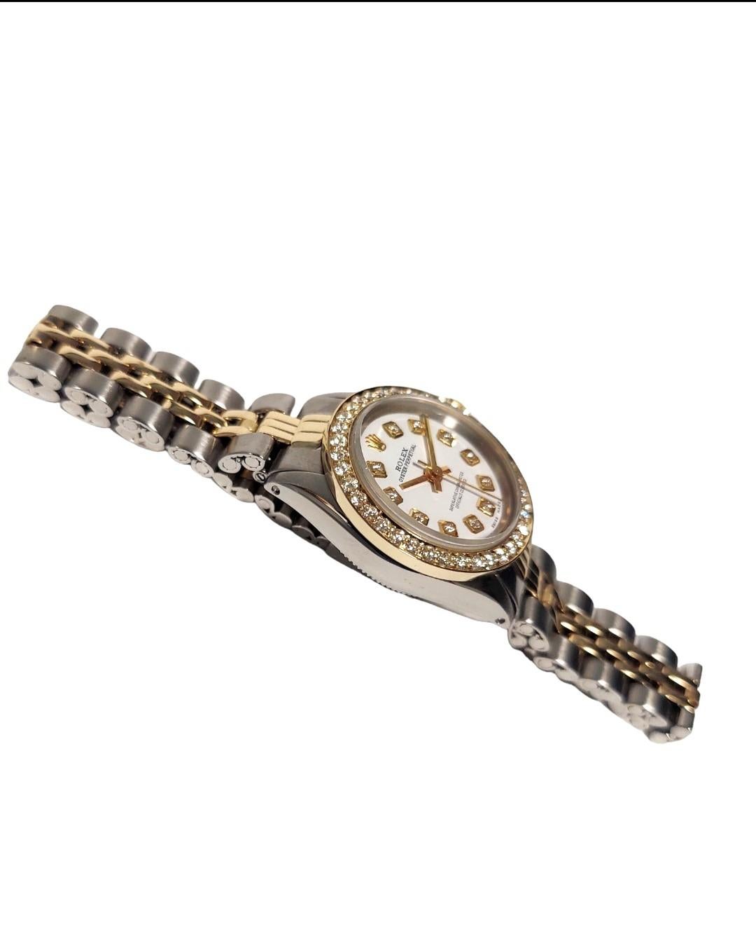 Brand - Rolex 
Style - oyster perpetual 
Gender- ladies 
Case size - 25mm
Model - 6619
Metals - stainless steel / Yellow Gold
Dial - custom White Diamond 
Bezel - Custom Yellow Gold Diamond 
Movement- Rolex automatic cal-1161 
Band - Twp-Tone folded