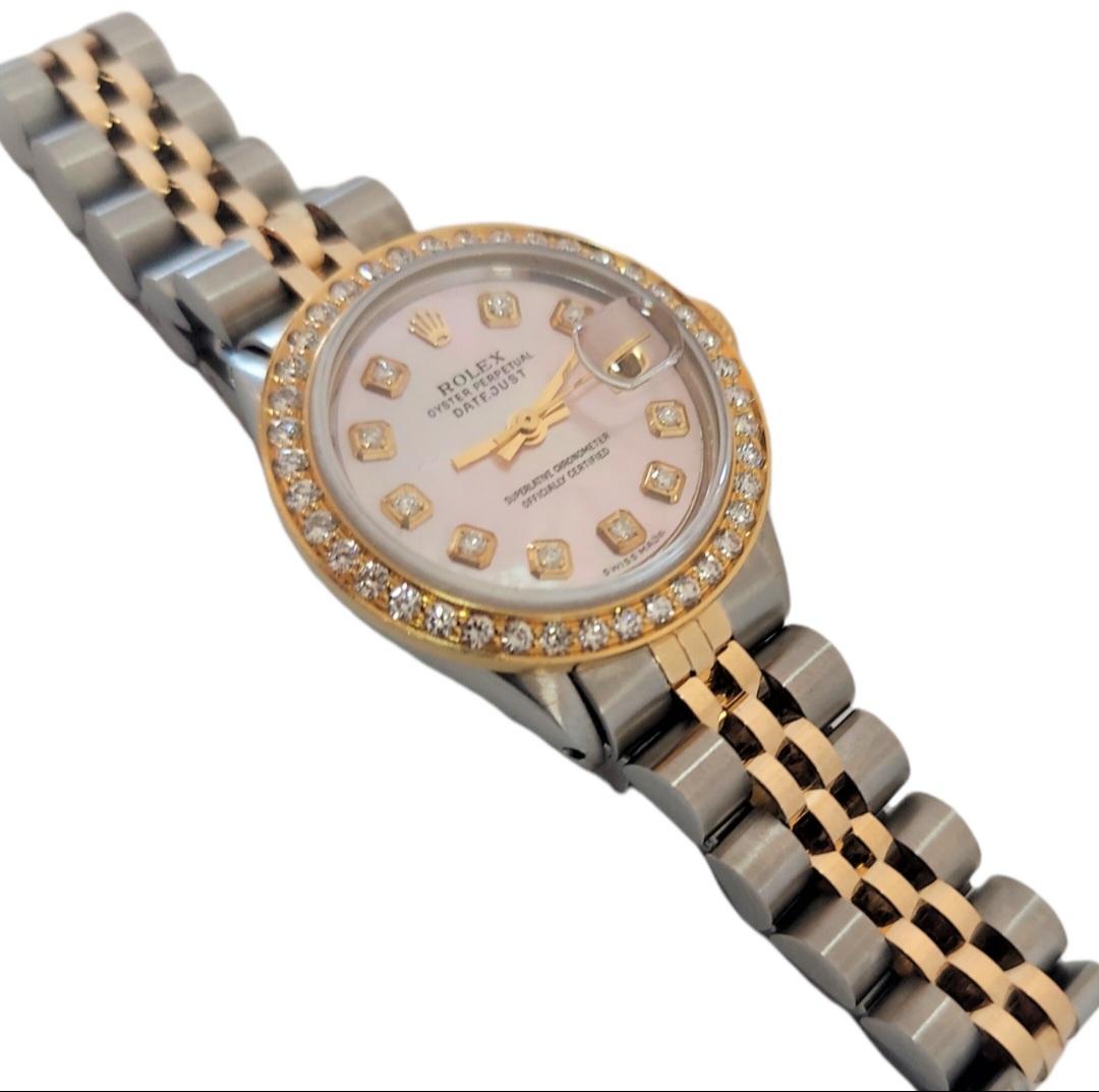 (Watch Description)
Brand - Rolex
Gender - Ladies
Model - 6517 Datejust 
Metals - Yellow gold/Stainless steel 
Case size - 26mm
Bezel - Yellow gold Diamond
Crystal - Sapphire
Movement - Automatic Rolex Cal.1161
Dial - Refinished Pink diamond 
Wrist