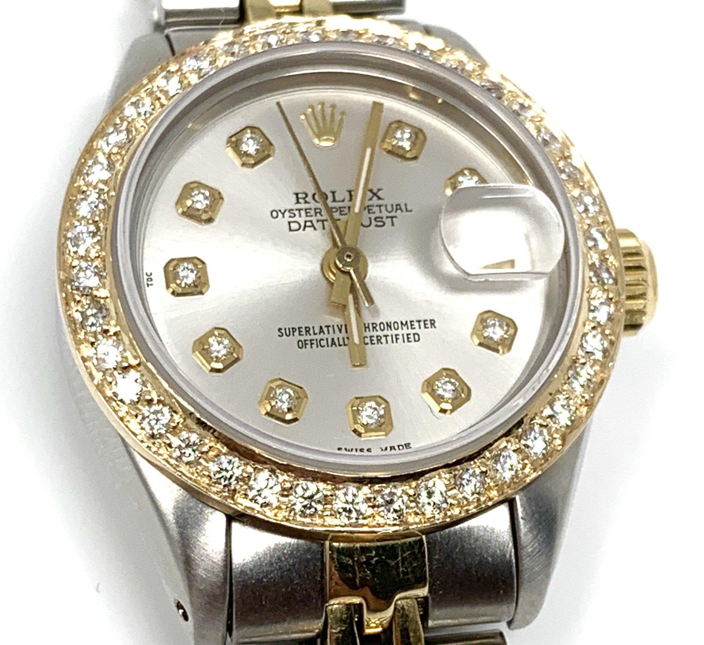 Brand - Rolex
Model - 6917 Datejust 
Gender - Ladies
Case Size - 26mm
Bezel - Steel Diamond
Dial - Refinished Silver Diamond
Crystal - Sapphire 
Movement - Automatic Rolex Cal.2030
Band - Steel Jubilee
Wrist Size - 7 IN

Two Year In House Warranty