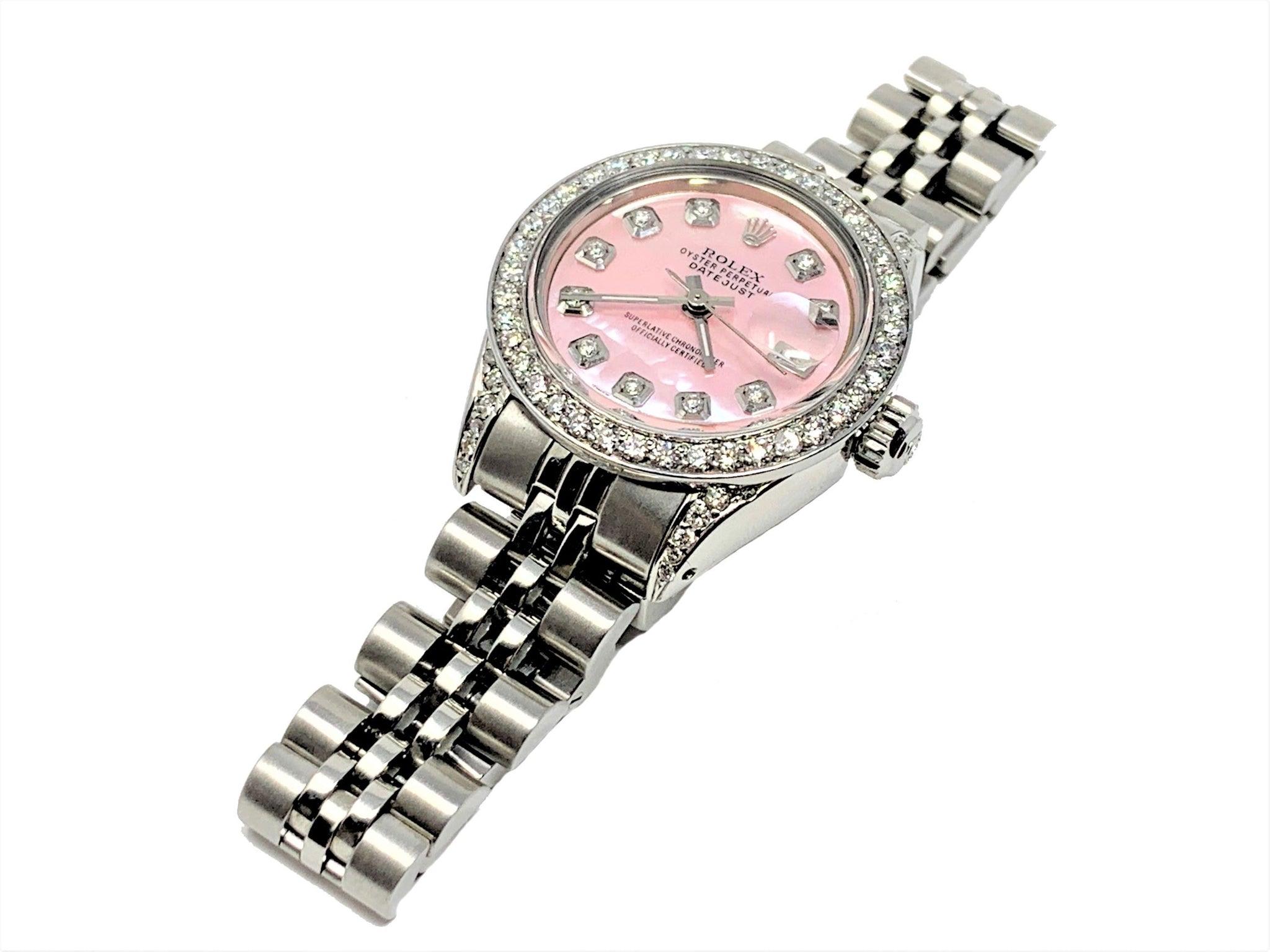 Brand - Rolex
Gender - Ladies
Condition - Pre owned
Style - Datejust 
Model - 6917
Metals - stainless steel 
Case size - 26mm
Bezel - stainless steel diamond
Crystal - sapphire
Movement - automatic caliber 2035 
Dial - Custom pink MOP Diamond
Wrist