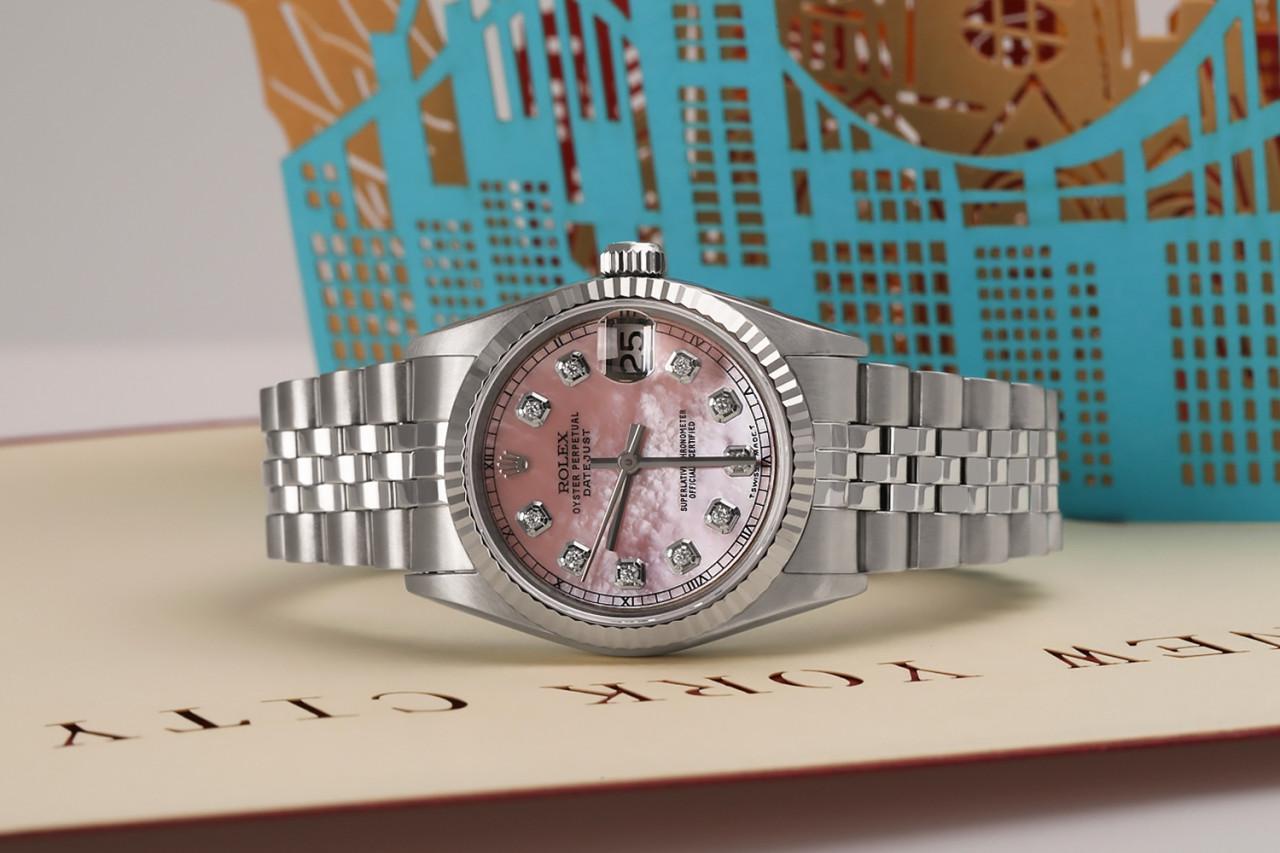 Rolex Datejust 26mm Cadran diamant RT en nacre rose personnalisé. Montre en acier inoxydable avec bracelet jubilé 69174.

Cette montre est dans un état comme neuf. Elle a été polie, entretenue et ne présente aucune rayure ou imperfection visible.
