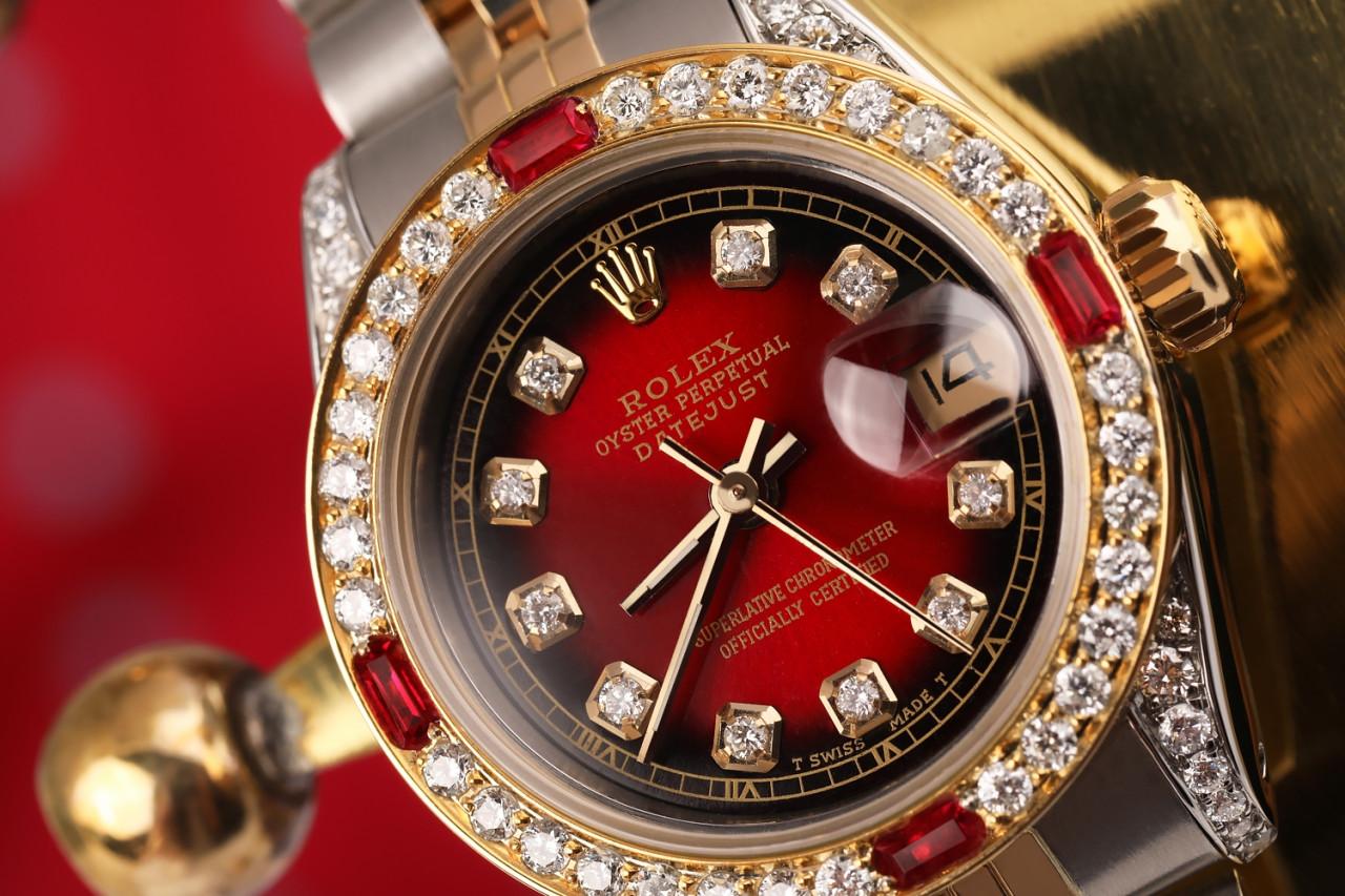 Ladies Rolex 26mm Datejust 69173 Two Tone Jubilee Red Vignette Color Dial Diamond Accent RT Bezel + Lugs + Rubies.

This watch is in like new condition. It has been polished, serviced and has no visible scratches or blemishes. All our watches come