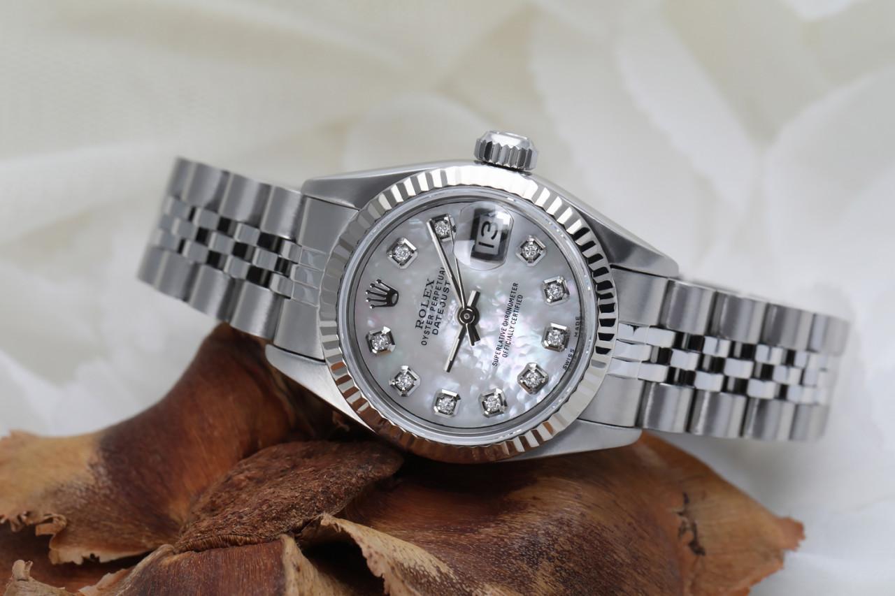 Ladies Rolex 26mm Datejust White MOP Mother Of Pearl Dial with Diamond Accen Deployment buckle 69174.

This watch is in like new condition. It has been polished, serviced and has no visible scratches or blemishes. All our watches come with a