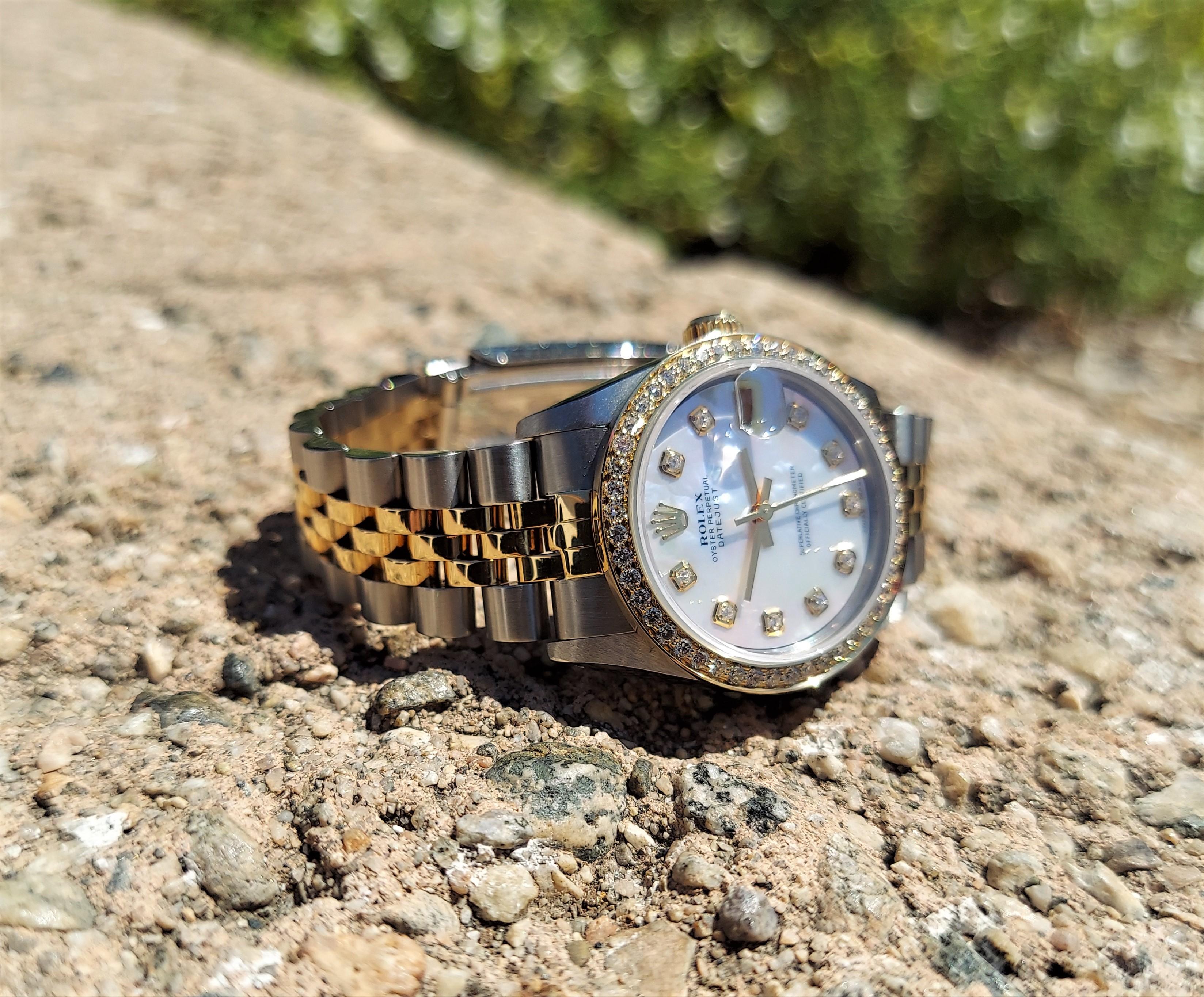 Brand - Rolex
Model - 68273 Datejust 
Metals - Yellow Gold/Steel
Case Size - 31mm
Crystal - Sapphire
Dial - MOP Diamond 
Movement - Automatic CAL.2135
Wrist size - Two tone Jubilee
Wrist Size - 7 inches 

3 Year In House warranty
Watch Appraisal