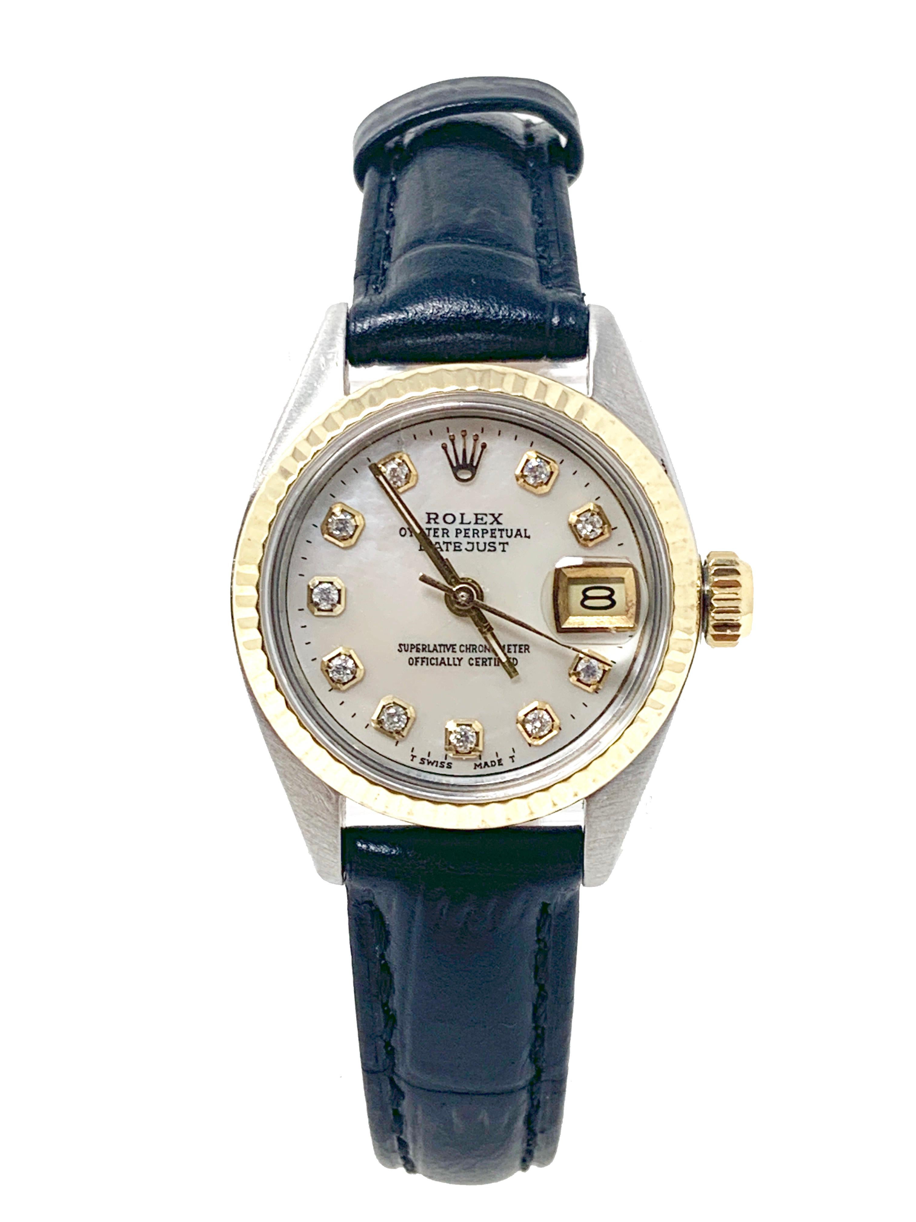 (Watch Description)
Brand - Rolex
Gender - Ladies
Model - 6917 Datejust 
Metals - Yellow gold/Stainless steel 
Case size - 26mm
Bezel - Yellow gold fluted
Crystal - Acrylic
Movement - Automatic Cal.2030
Dial - Mother of pearl diamond
Wrist band -