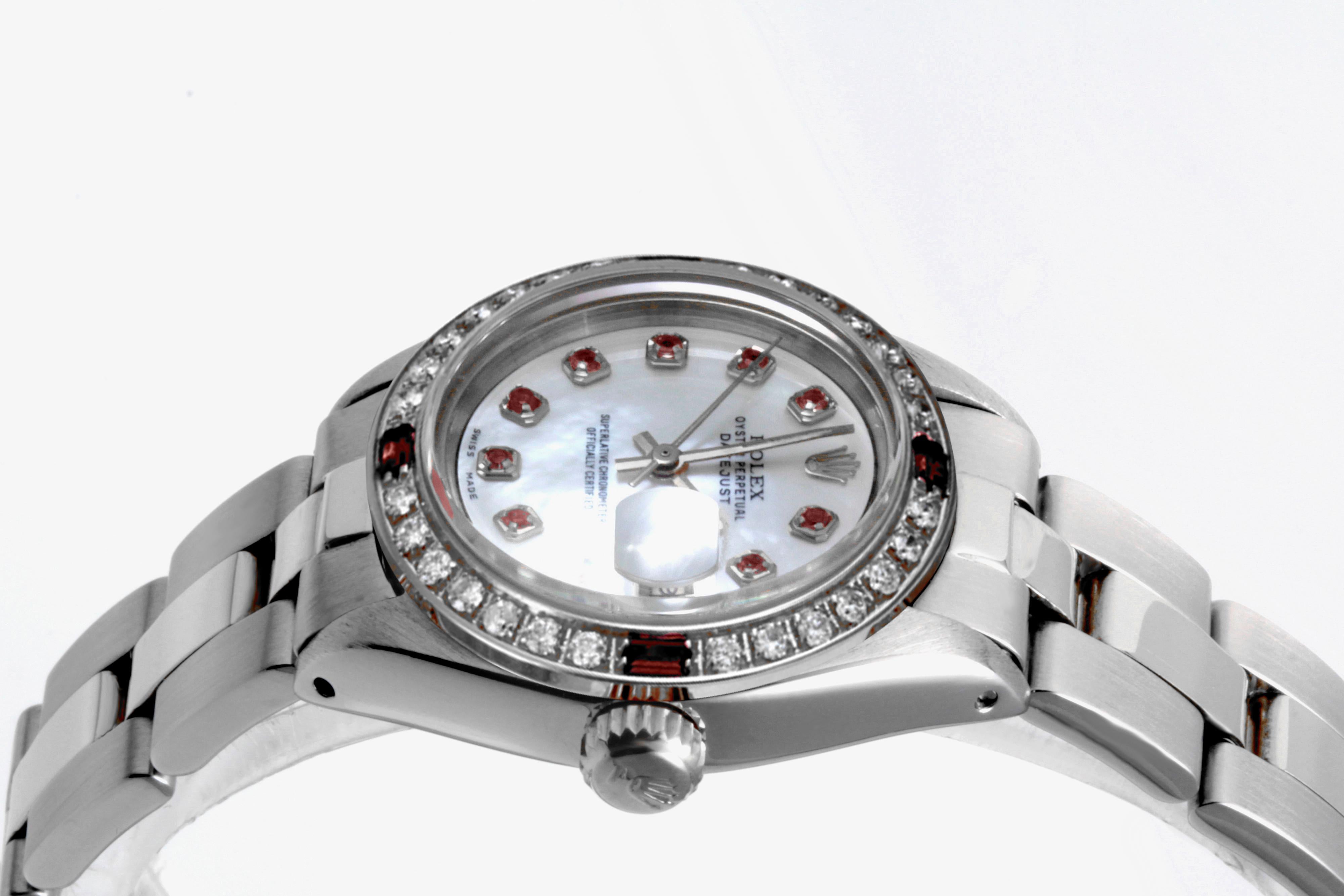 Brand - Rolex
Gender - Ladies
Model - 6919 Datejust
Metals - Stainless Steel
Case size - 26 mm
Bezel - Steel Diamond Ruby
Crystal - Sapphire
Movement - Automatic Cal.2035
Dial - Refinished MP ruby 
Wrist band - Steel Oyster
Wrist size - 7 1/2 Inche