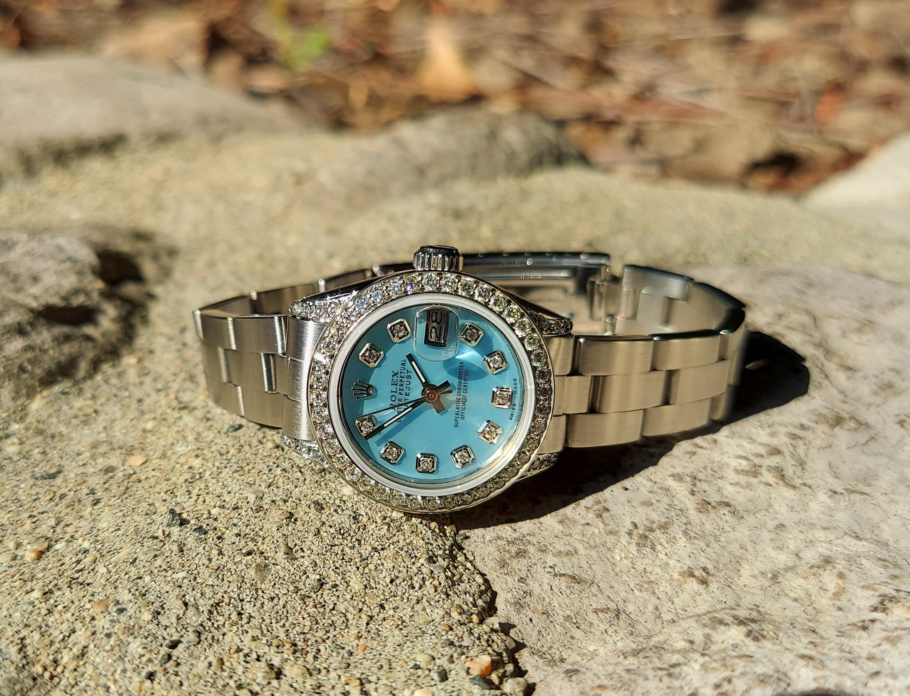 Description
Brand - Rolex
Model - 6917
Style - Datejust 
Case size - 26mm 
Bezel - Custom steel 1.0CT diamond 
Dial -custom MOP diamond 
Crystal- sapphire 
Movement - Rolex Automatic Cal-2030
Band - oyster stainless stee