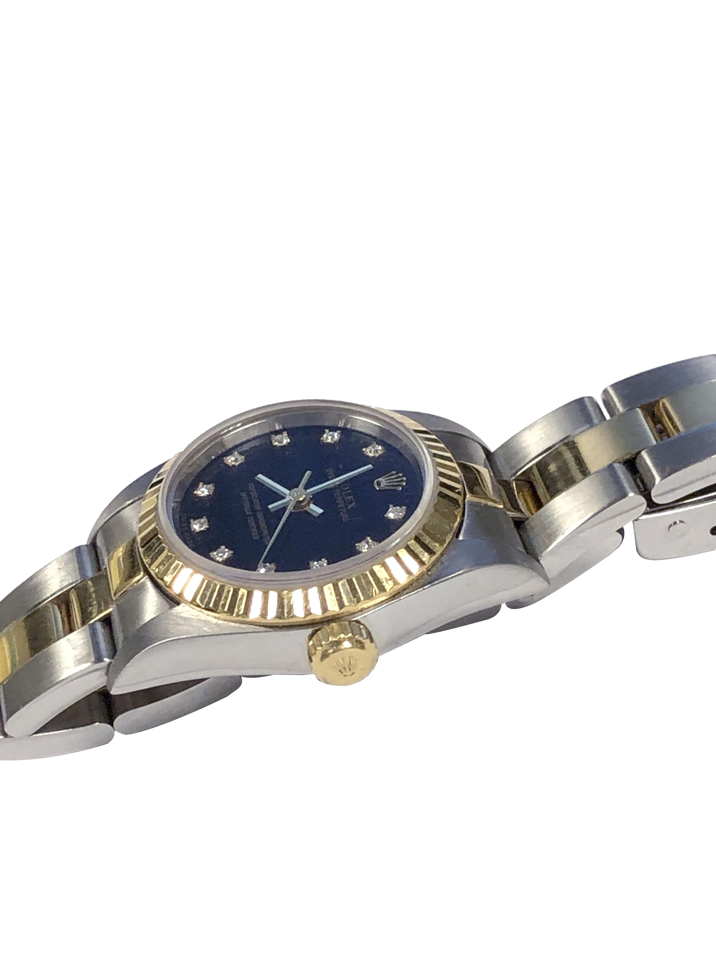 Circa 1999 Rolex Ladies Reference 76193 Wrist Watch, 24 M.M. 3 Piece Stainless Steel Oyster Case with 18k Yellow Gold Fluted bezel. Caliber 2230 Automatic, self winding movement, Black Dial with Diamond set Markers, Sapphire Glass Crystal. Steel and