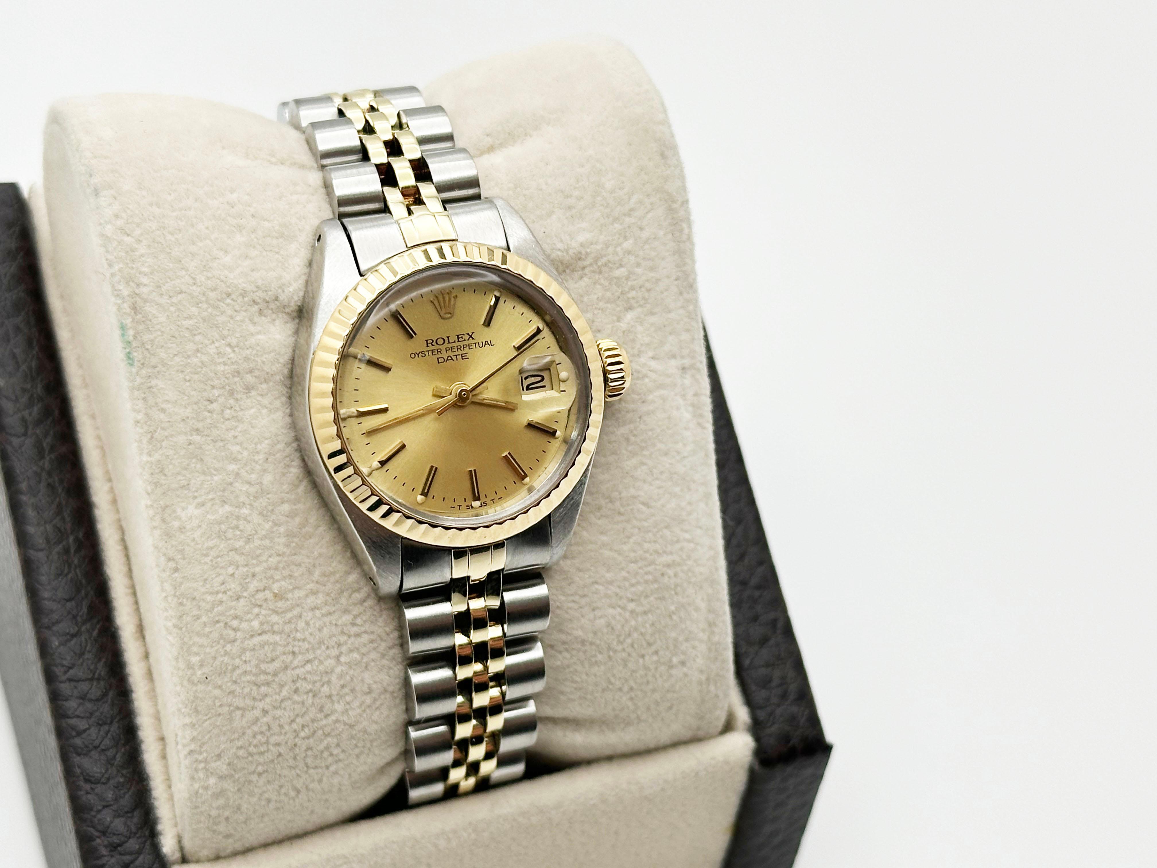 Style Number: 6917



Serial: 7042***



Year: 1981

 

Model: Rolex Ladies Date 

 

Case Material: Stainless Steel 

 

Band: 14K Yellow Gold & Stainless Steel 

  

Bezel: 14K Yellow Gold 

  

Dial: Champagne Dial 

 

Face: Acrylic 

 

Case