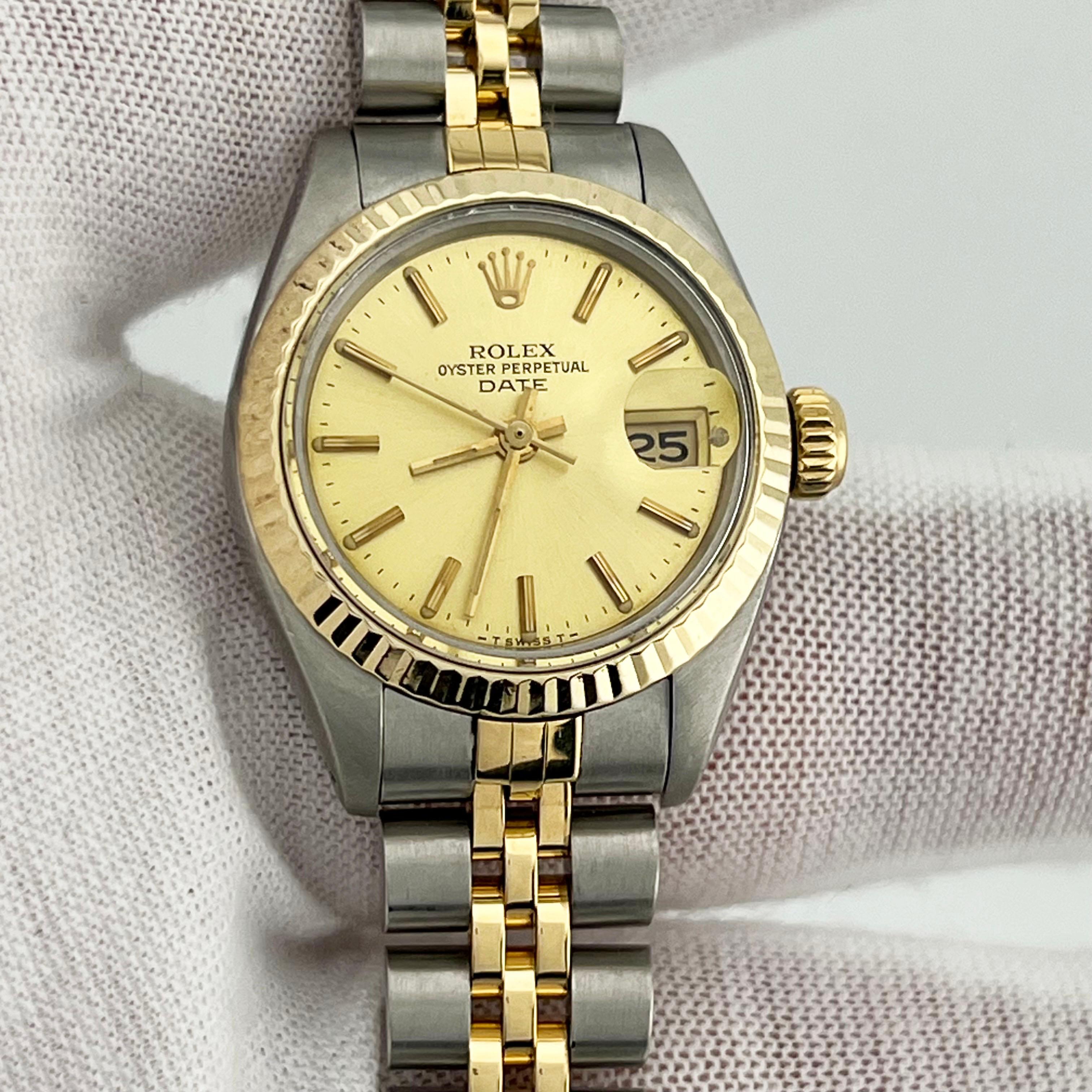 Rolex Montre pour femmes Date 6917, cadran champagne en or jaune 18 carats et acier inoxydable 26 mm