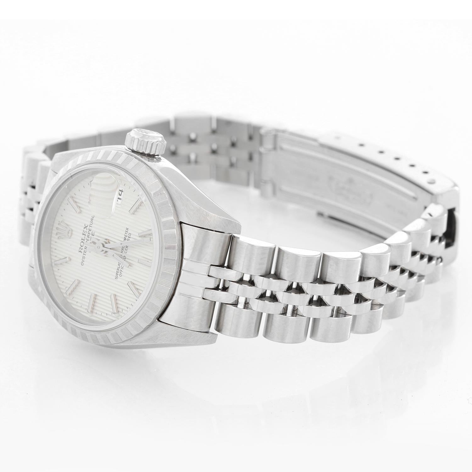 Rolex Ladies Date Stainless Steel Watch 79240 - Automatic winding, 31 jewels, Quickset, sapphire crystal. Stainless steel case with white gold fluted bezel 26mm diameter. Silver Tapestry dial with stick markers. Stainless steel Jubilee bracelet.