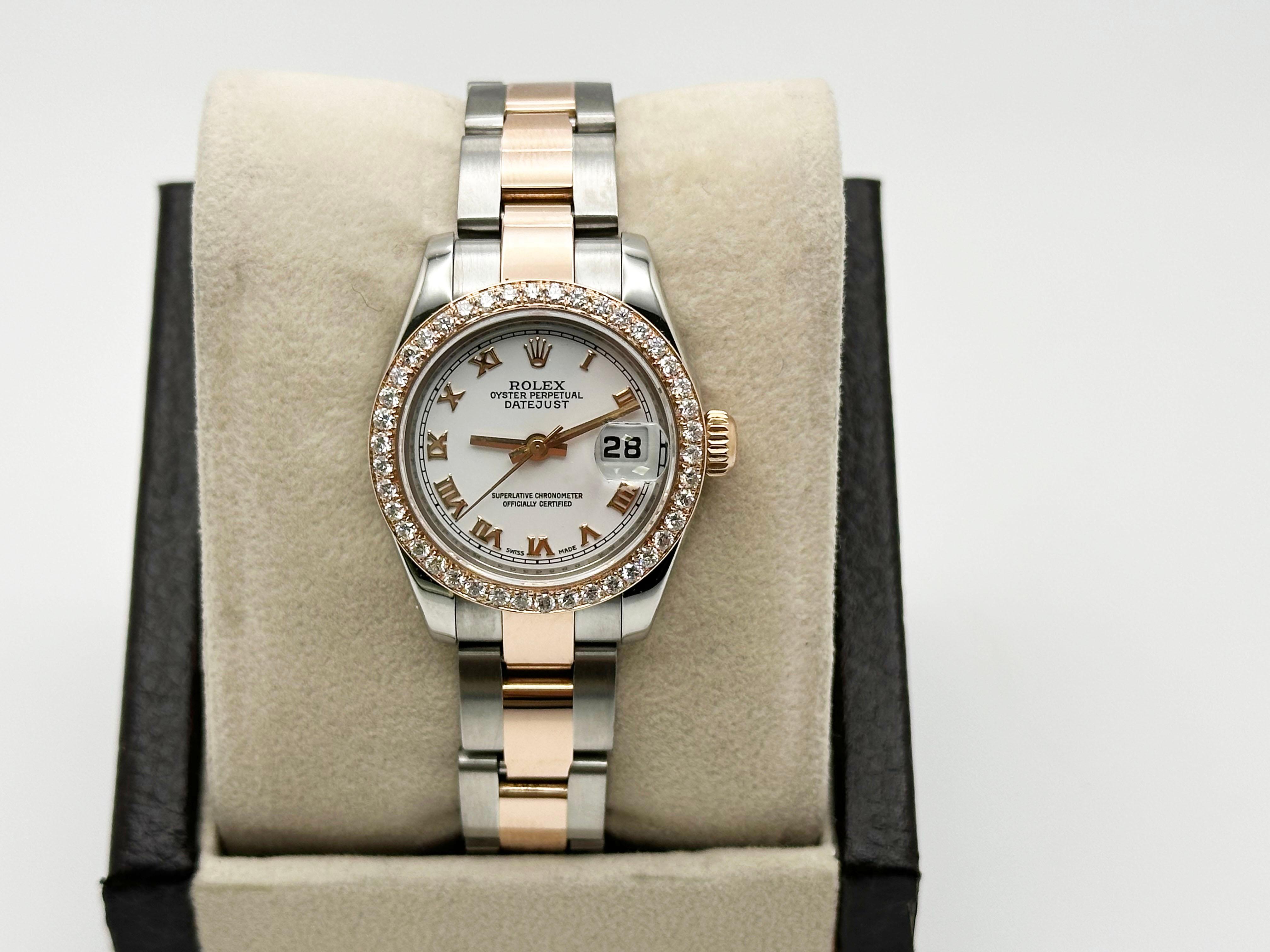 Style Number: 179161



Serial: D950***



Year: 2010

 

Model: Rolex Ladies Datejust 

 

Case Material: Stainless Steel 

 

Band: 18K Rose Gold & Stainless Steel 

  

Bezel: Custom Diamond Bezel 

  

Dial: White Roman Dial 

 

Face: Sapphire