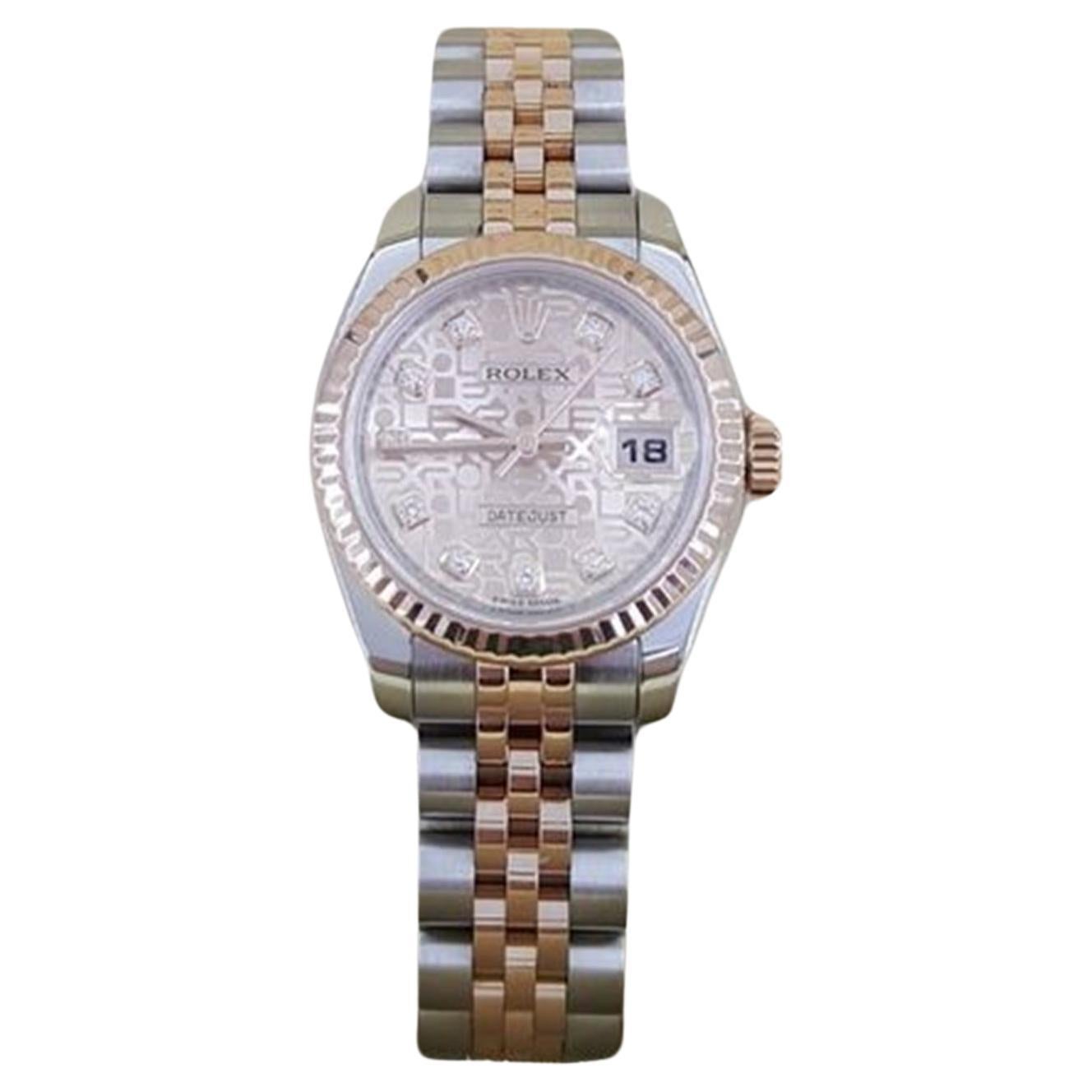 Rolex Ladies Datejust 179171 Factory Pink Jubilee Diamond Dial 26 mm 2-Tone Stainless Steel & 18k Rose Gold Complete w/ Box & Card.

The watch features a screw-down crown, 18k Rose Gold Fluted Bezel, Sapphire Crystal, Pink Jubilee Factory Diamond