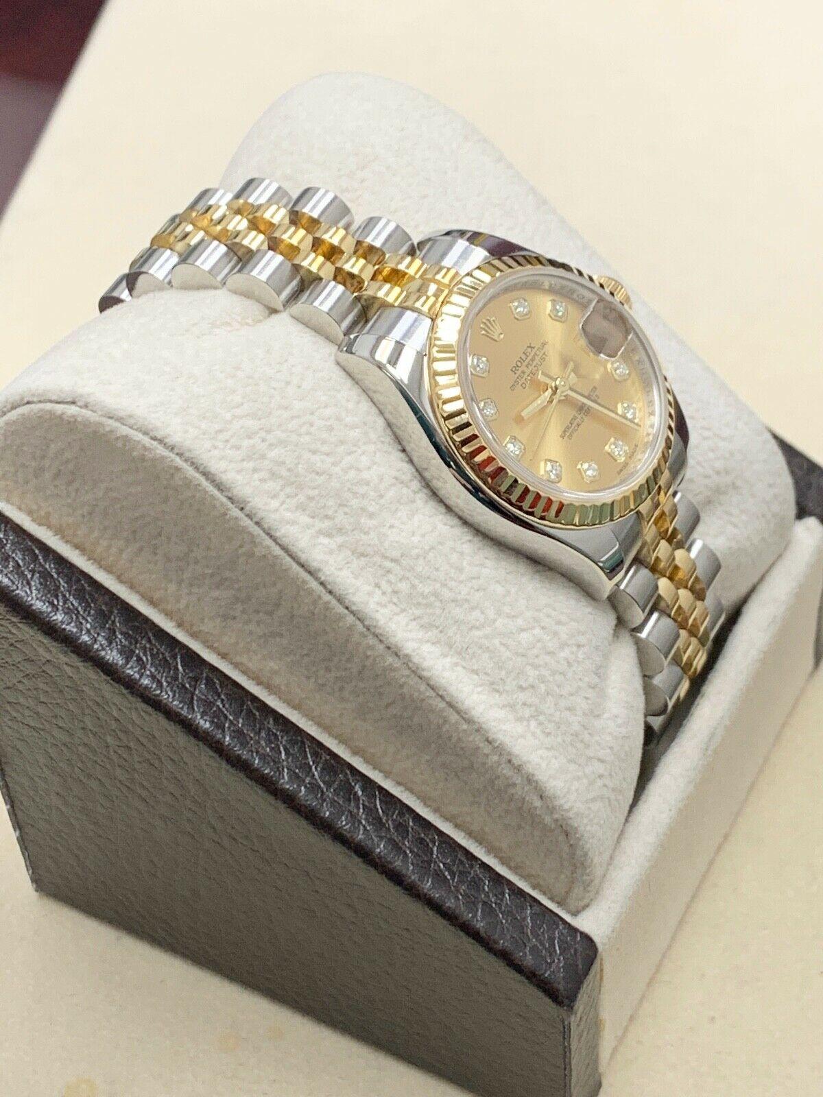 Style Number: 179173

Serial: Z555***

Year: 2007

Model: Datejust

Case Material: Stainless Steel

Band: 18K Yellow Gold & Stainless Steel

Bezel:  18K Yellow Gold 

Dial: Original Factory Champagne Diamond Dial 

Face: Sapphire Crystal 
 
Case