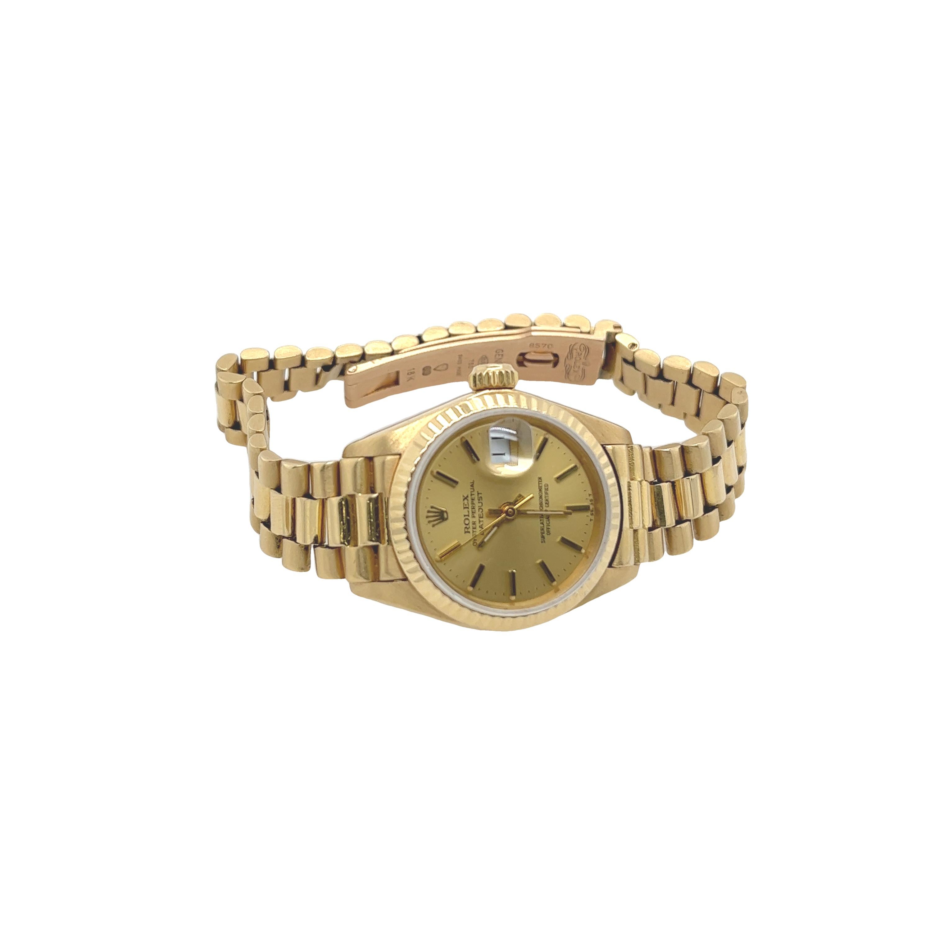 Rolex Ladies Datejust 18ct Yellow Gold President Bracelet Is a timeless piece, With original box, no papers.

Total Weight: 66.6g
18ct yellow gold
Case size: 26mm
Dial Colour: Gold
Crystal: Sapphire
Serial No.8570
Rolex Box 
APPO80