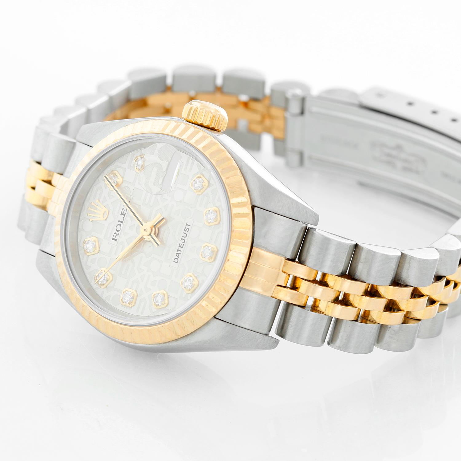 Rolex Ladies Datejust 2-Tone Steel & Gold Watch 79173 - Automatic winding, 29 jewels, Quickset date, sapphire crystal. Stainless steel case with 18k yellow gold fluted bezel  (26mm diameter). Genuine Rolex Silver Jubilee diamond dial. Stainless