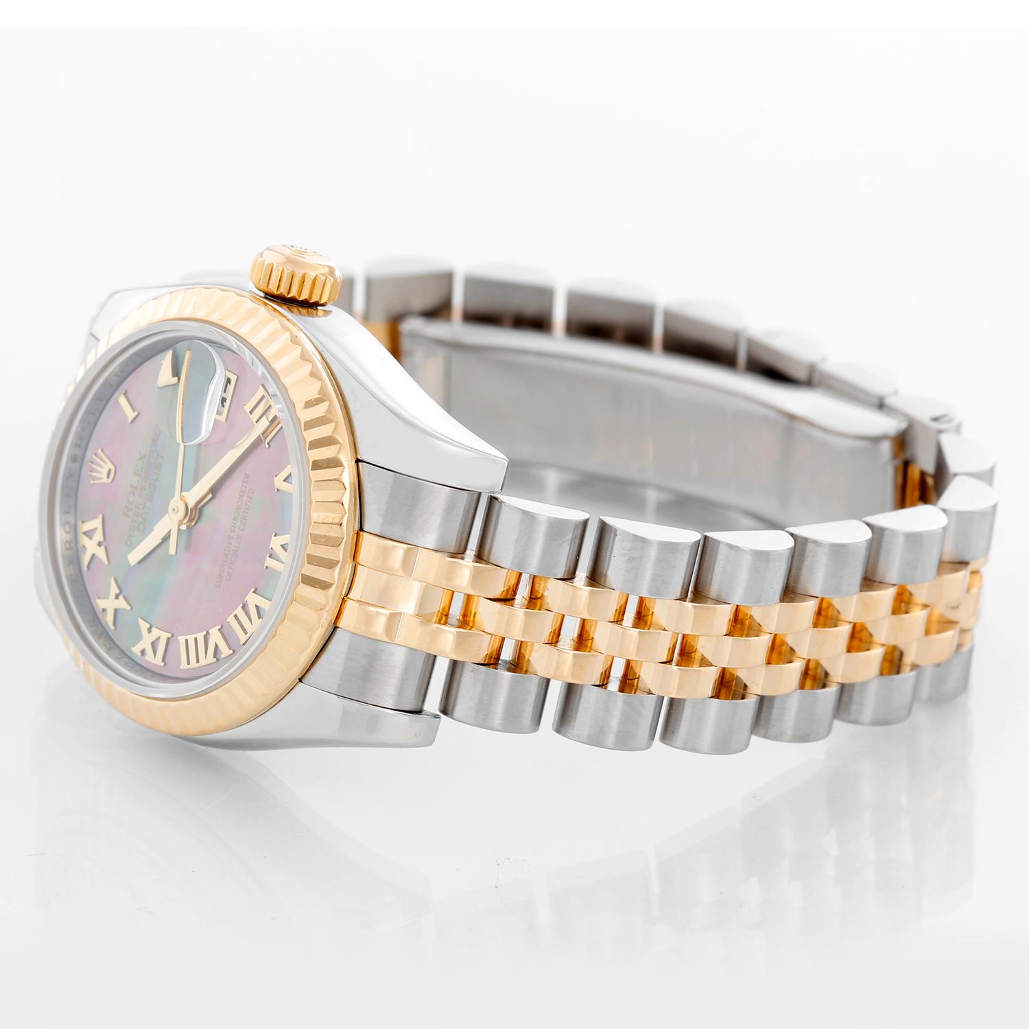 Rolex Ladies Datejust 2-Tone Watch 179173  - Automatic winding, Quickset, 31 jewels, sapphire crystal. Stainless steel case with 18k yellow gold fluted bezel ( 26 mm). Mother of Pearl dial with roman numerals. Stainless steel and 18k yellow gold