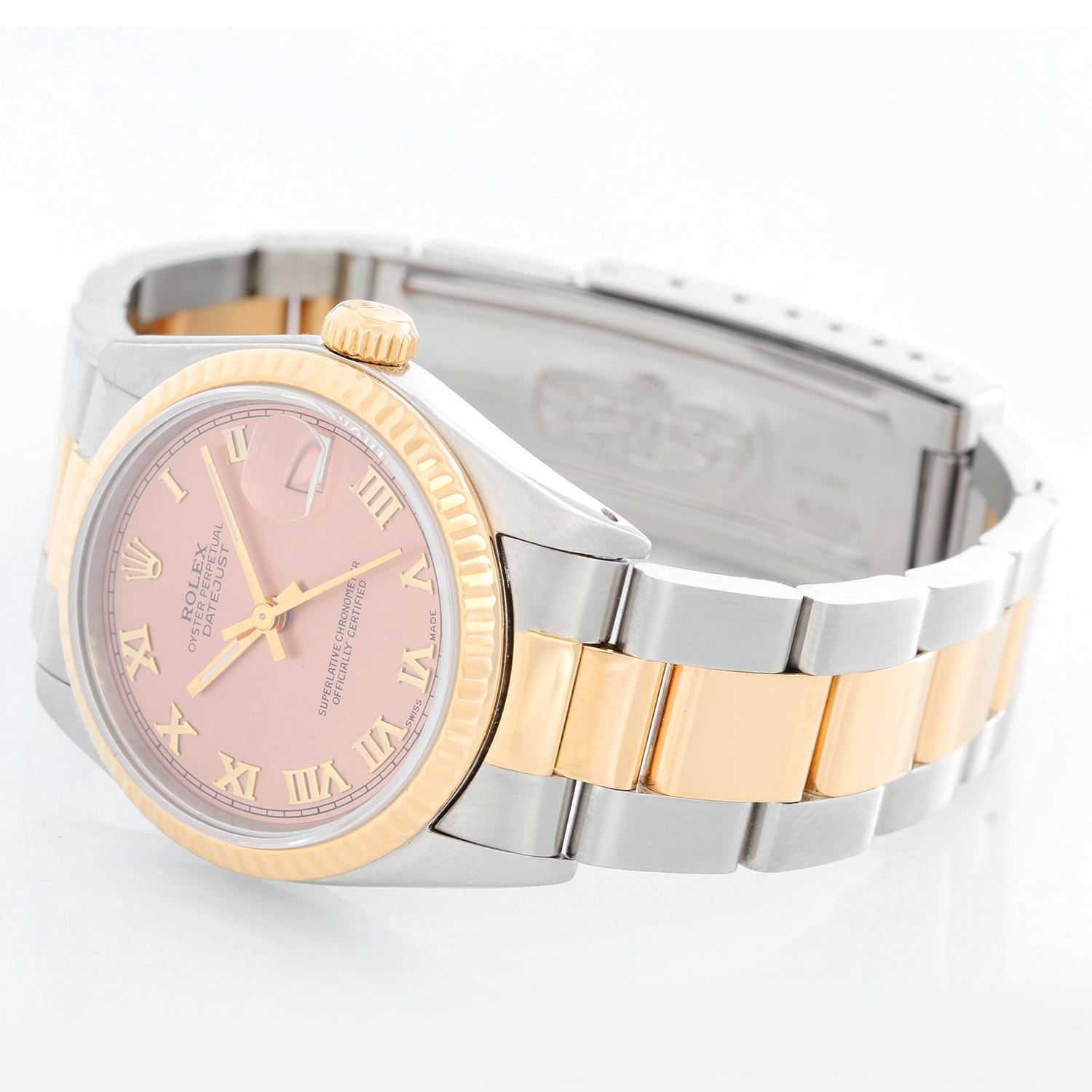Rolex Ladies Datejust 2-Tone Watch 68273 White Dial  - Automatic winding, Quickset, 31 jewels, sapphire crystal. Stainless steel 31mm case with 18k yellow gold fluted bezel . Salmon dial with gold roman numerals. Stainless steel and 18k yellow gold