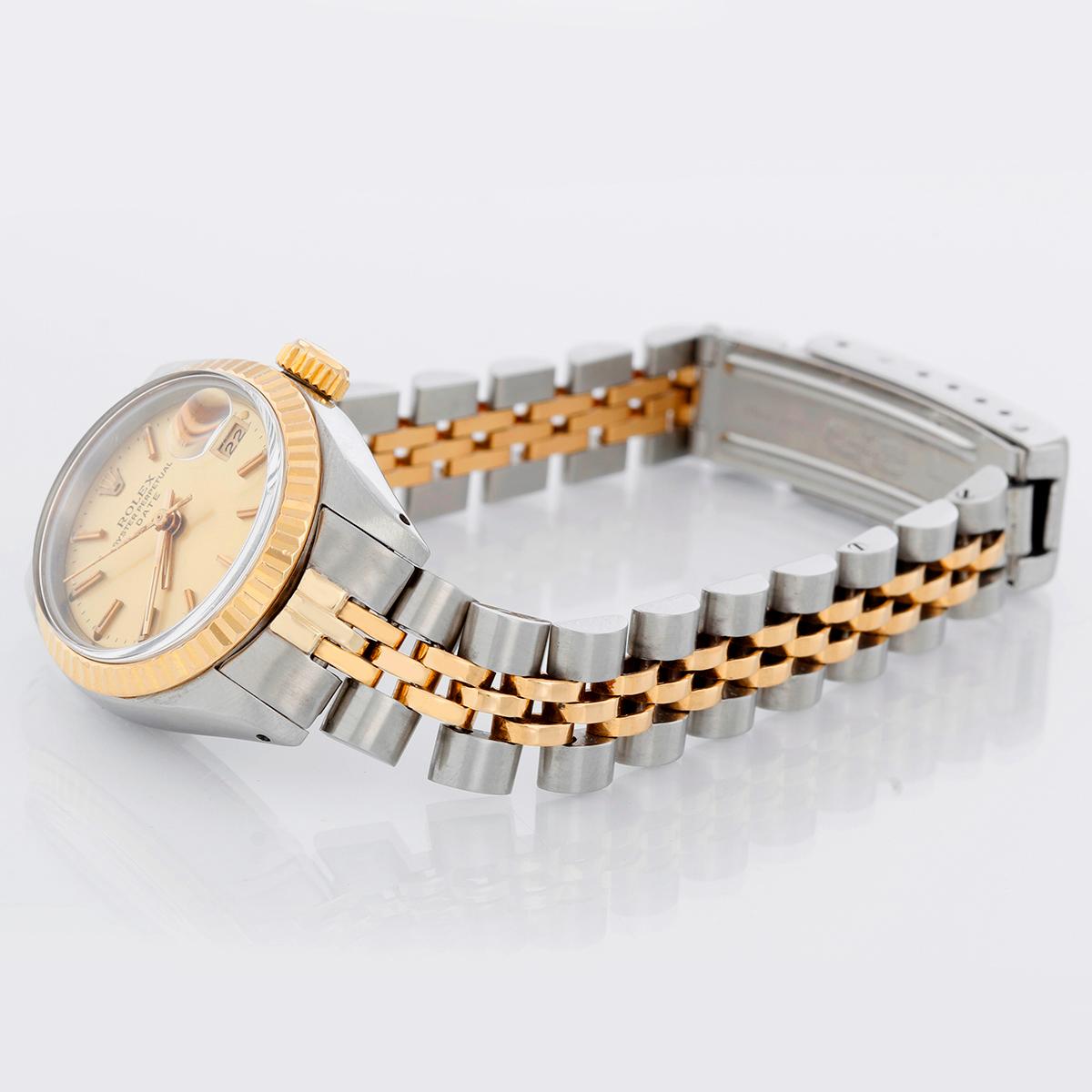 Rolex Ladies Datejust 2-tone Watch 6917 - Automatic winding, acrylic crystal. Stainless steel case with yellow gold Fluted bezel (26mm diameter). Champagne stick dial. Stainless steel and 14k yellow gold Jubilee bracelet. Pre-owned with custom box.