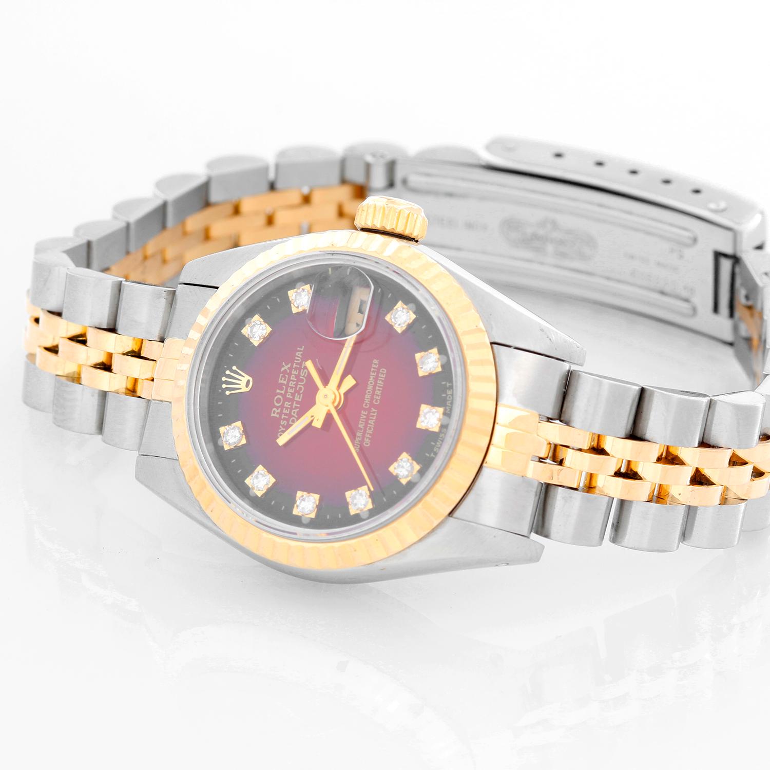 Rolex Ladies Datejust 2-tone Watch 69173 - Automatic winding, 29 jewels, Quickset date, sapphire crystal. Stainless steel case with yellow gold Fluted bezel (26mm diameter). Vignette Red diamond dial. Stainless steel and 18k yellow gold Jubilee