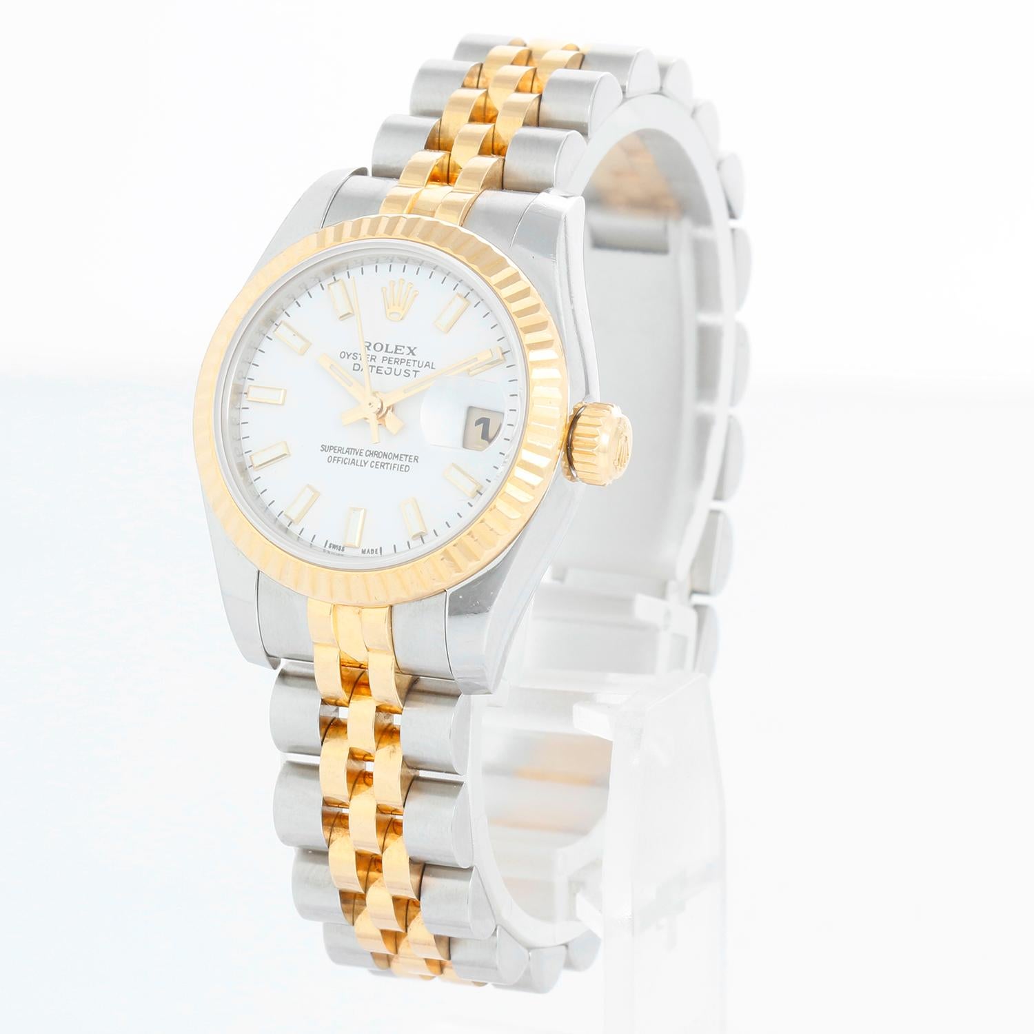 Rolex Ladies Datejust 2-Tone Watch 179173 - Automatic winding, Quickset, 31 jewels, sapphire crystal. Stainless steel case with 18k yellow gold fluted bezel ( 26 mm). White dial with stick hour markers. Stainless steel and 18k yellow gold hidden