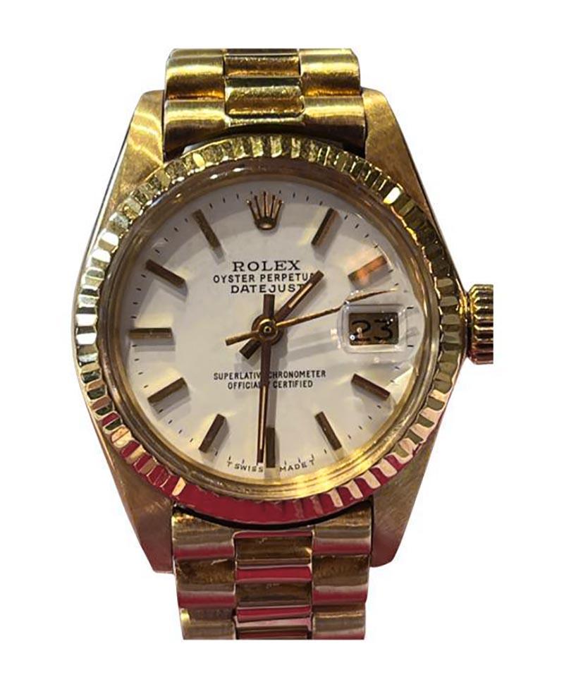 Gorgeous vintage Ladies Rolex Presidential with white dial. A true classic.

Brand: Rolex 

Model Name: Datejust

Model Number: 6917

Movement: Automatic 

Case Size: 26 mm

Case Material:  18k Yellow Gold

Bezel: 18k Yellow Gold 

Dial: