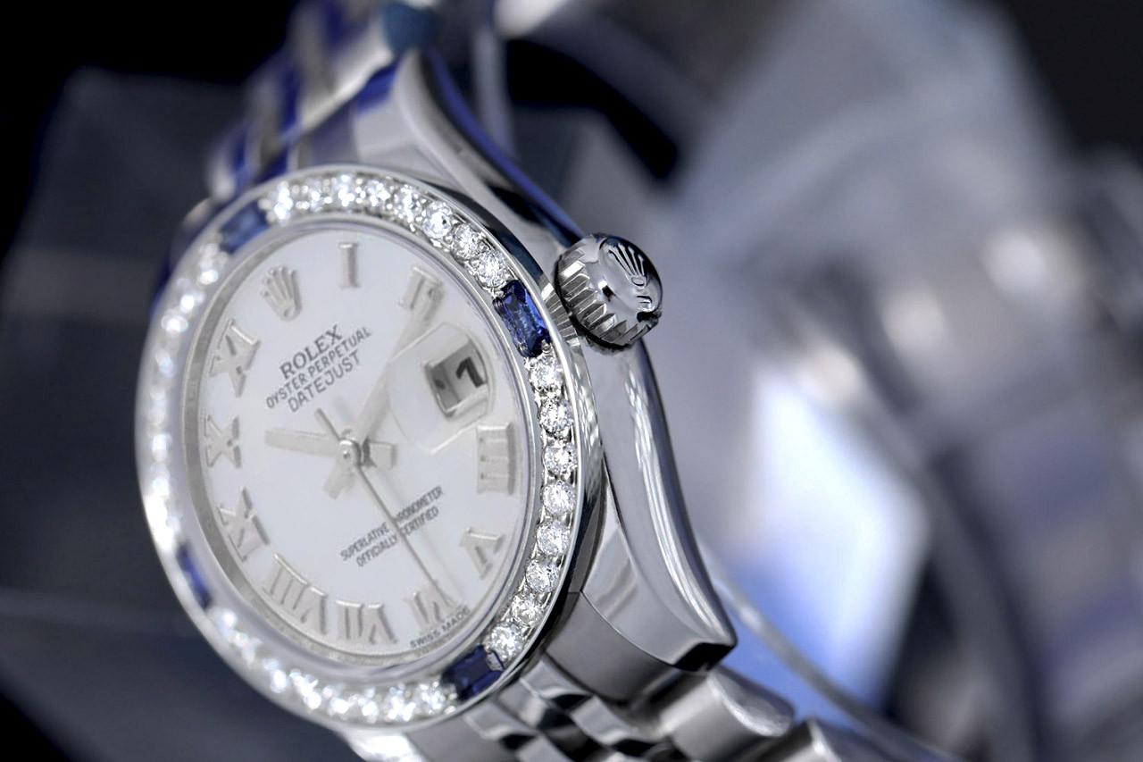 Rolex Ladies Datejust 26mm White Roman Numerals Dial 179174 Diamond/Sapphire Bezel Steel Ladies Watch

Listed images are actual pictures of the watch. We guarantee the watch you receive corresponds 100% to the model when viewed in person. We can