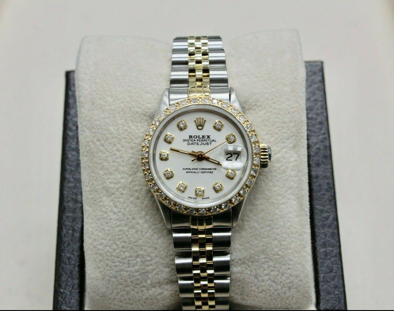 Style Number: 6516
Serial: 2449***
Model: Ladies Datejust
Case Material: Stainless Steel
Band: 14K Yellow Gold & Stainless Steel 
Bezel: Custom Diamond Bezel
Dial: Custom Diamond Dial 
Face: Sapphire Crystal
Case Size: 26mm
Includes: 
-Elegant Watch
