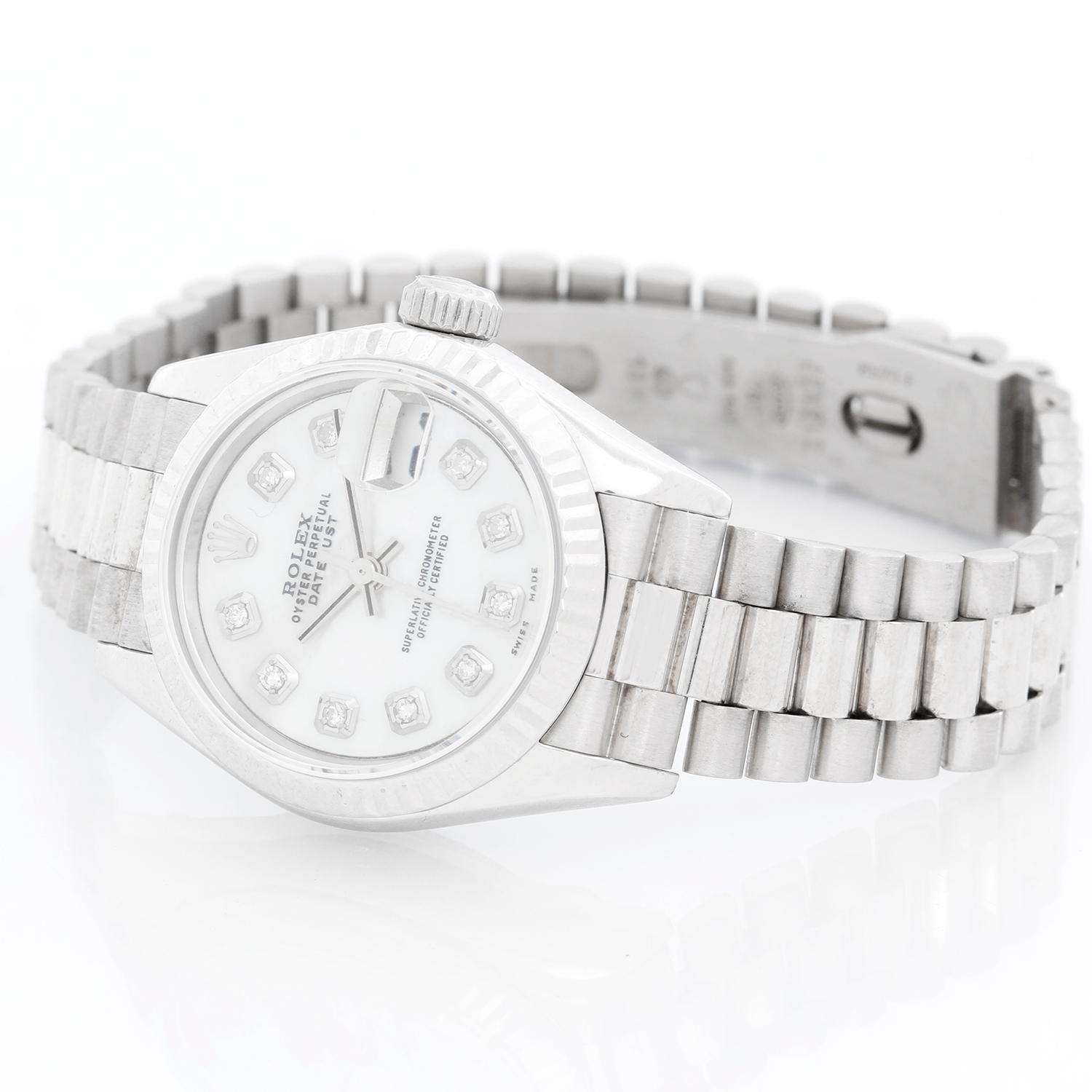 Rolex Ladies Datejust 69139 President Bracelet  - Automatic winding. 18k white gold case  ( 26 mm ) . Custom Mother of Pearl Diamond dial . 18k white gold hidden clasp President bracelet. Pre-owned with box .