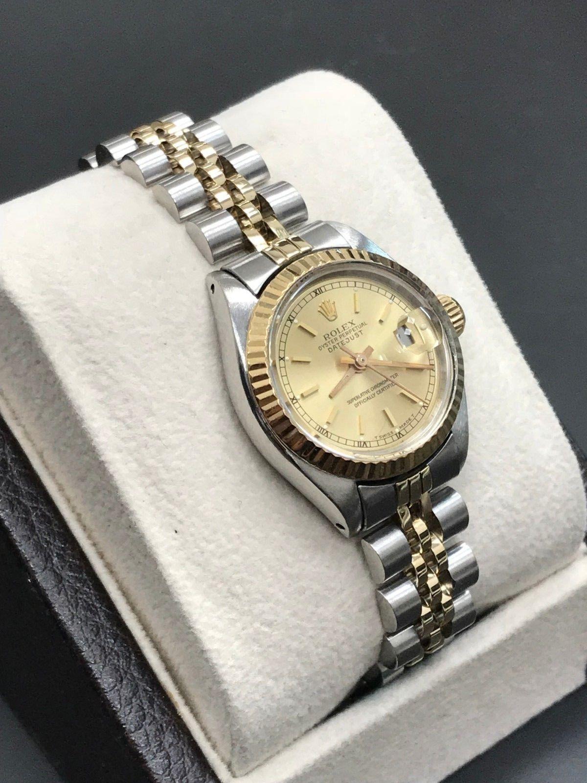 Style Number: 6916
Serial: 5430***
Model: Datejust
Case Material: Stainless Steel
Band: 18K Yellow Gold & Stainless Steel 
Bezel: 18K Yellow Gold 
Dial: Champagne 
Face: Acrylic 
Case Size: 26mm
Includes: 
-Elegant Watch Box
-Certified Appraisal 
-6
