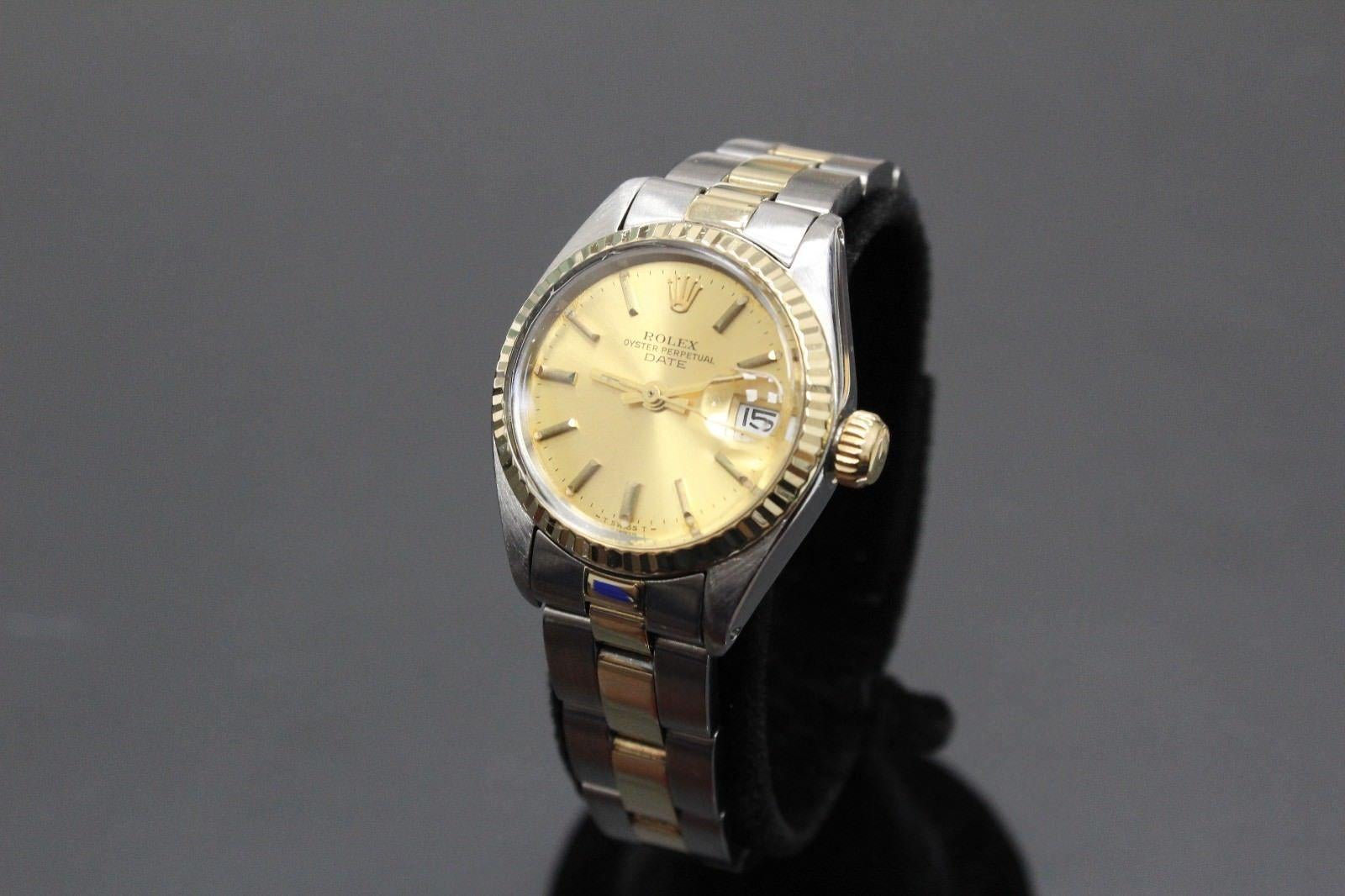 Style Number: 6917
Serial: 5669***
Model: Datejust
Case Material: Stainless Steel
Band: 14K Yellow Gold & Stainless Steel
Bezel: 14K Yellow Gold
Dial: Champagne
Face: Acrylic 
Case Size: 26mm
Includes: 
-Elegant Watch Box
-Certified Appraisal 
-6