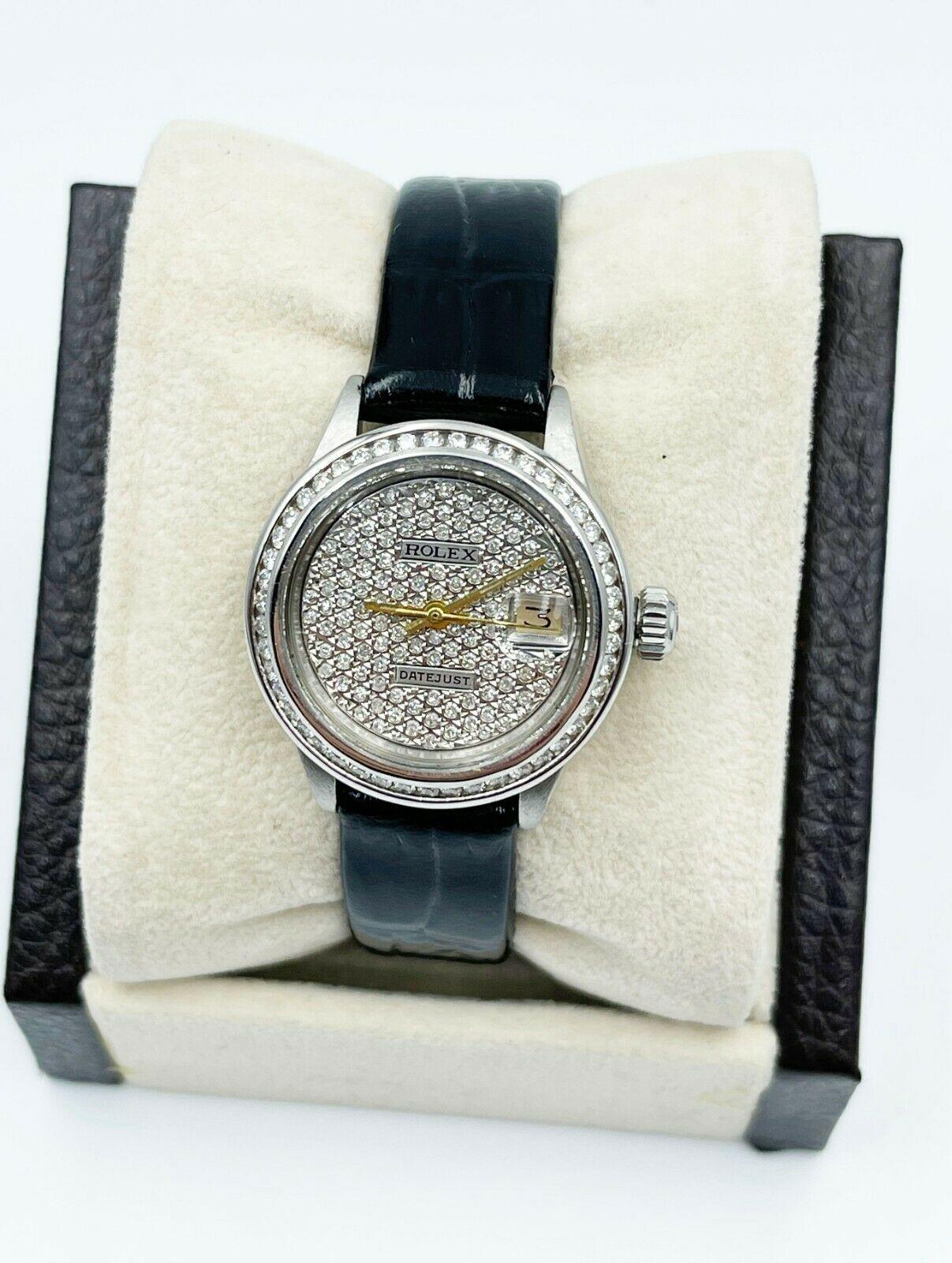 Style Number: 6917

 

Serial: 3137***

 

Model: Ladies Datejust

 

Case Material: Stainless Steel

 

Band: Custom Leather Band 

 

Bezel: Custom Diamond Bezel 

 

Dial: Custom Diamond Dial 

 

Face: Acrylic 

 

Case Size: 26mm

 

Includes: