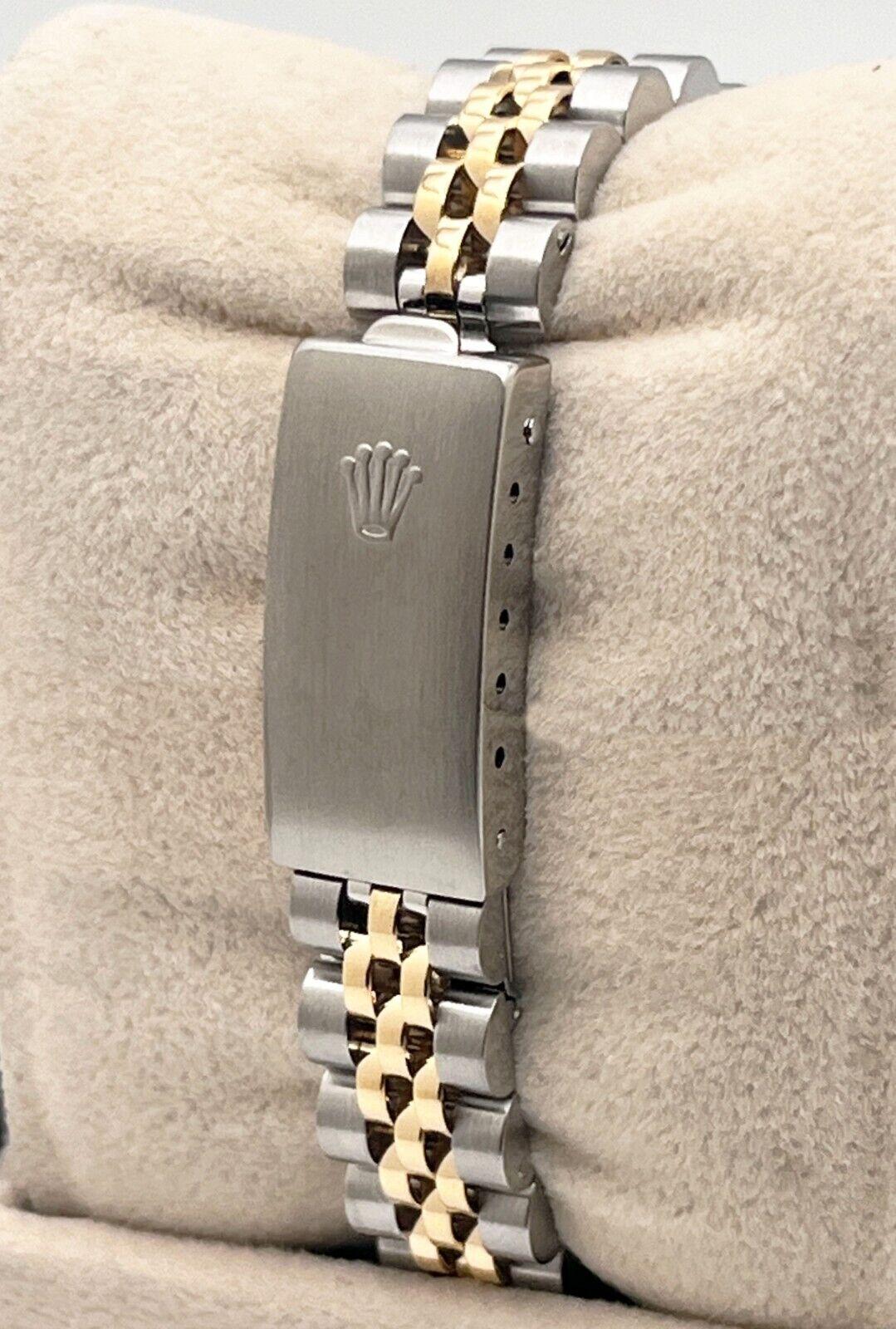 Style Number: 69173
Serial: E162***
Year: 1990
Model: Rolex Ladies Datejust
Case Material: Stainless Steel
Band: 18K Yellow Gold & Stainless Steel
Bezel: 18K Yellow Gold
Dial: Champagne Tapestry Dial
Face: Sapphire Crystal
Case Size: 26mm
Includes:
