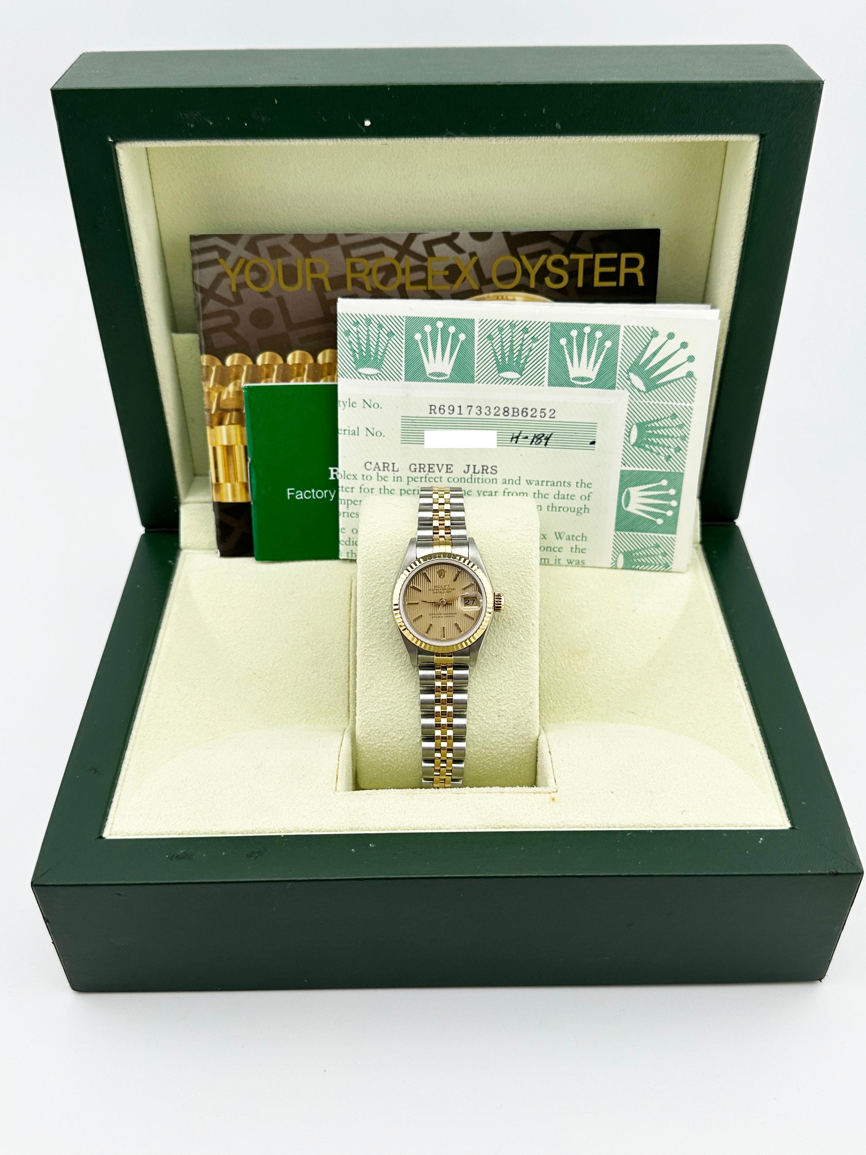 Style Number: 69173



Year: 1993

 

Model: Rolex Ladies Datejust 

 

Case Material: Stainless Steel 

 

Band: 18K Yellow Gold & Stainless Steel 

  

Bezel: 18K Yellow Gold 

  

Dial: Champagne Tapestry Dial 

 

Face: Sapphire Crystal 


