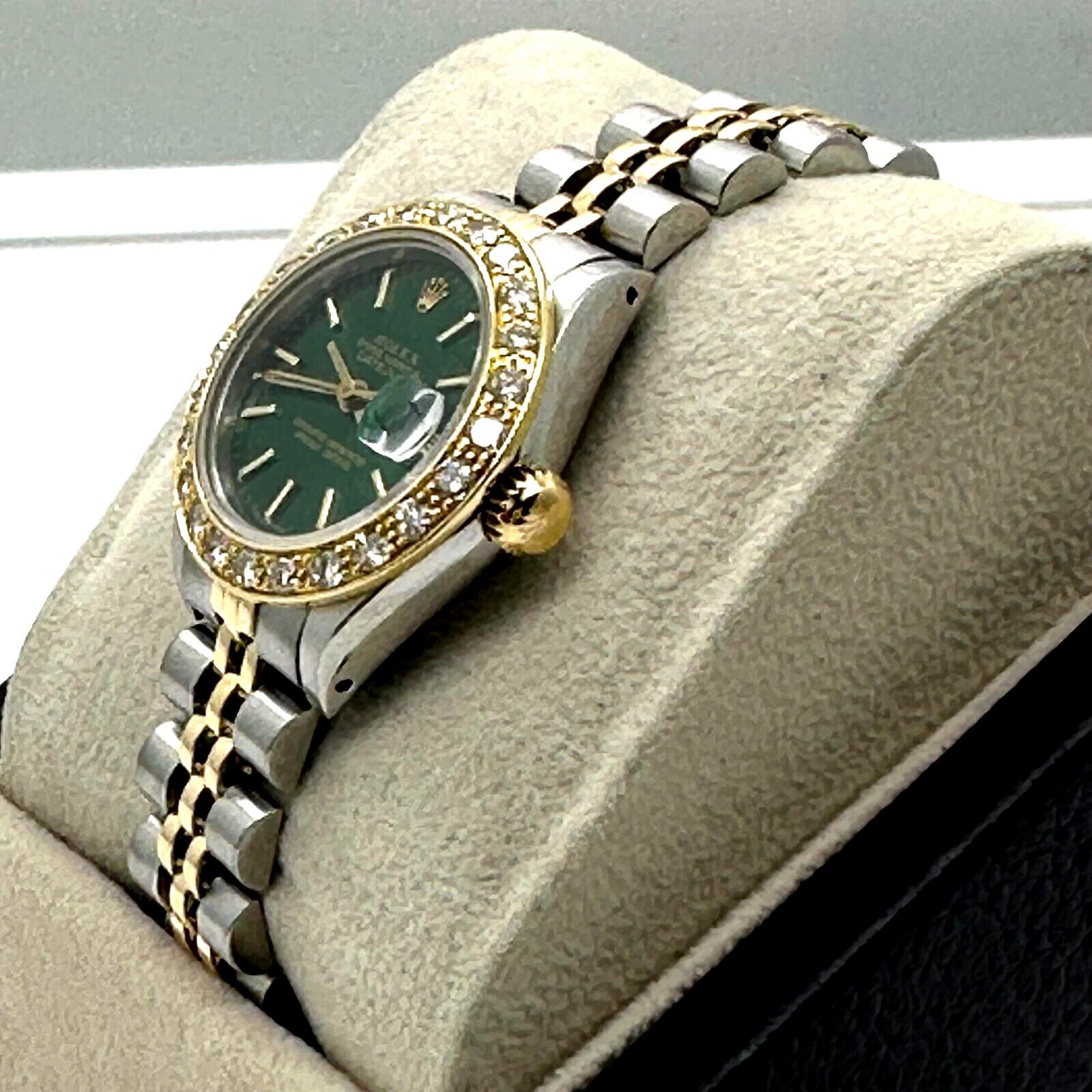 Style Number: 69173

Serial: 8615***

Year: 1984

Model: Ladies Datejust

Case Material: Stainless Steel 

Band: 18K Yellow Gold & Stainless Steel 

Bezel: Custom Diamond Bezel

Dial: Custom Green Dial

Face: Sapphire Crystal

Case Size: