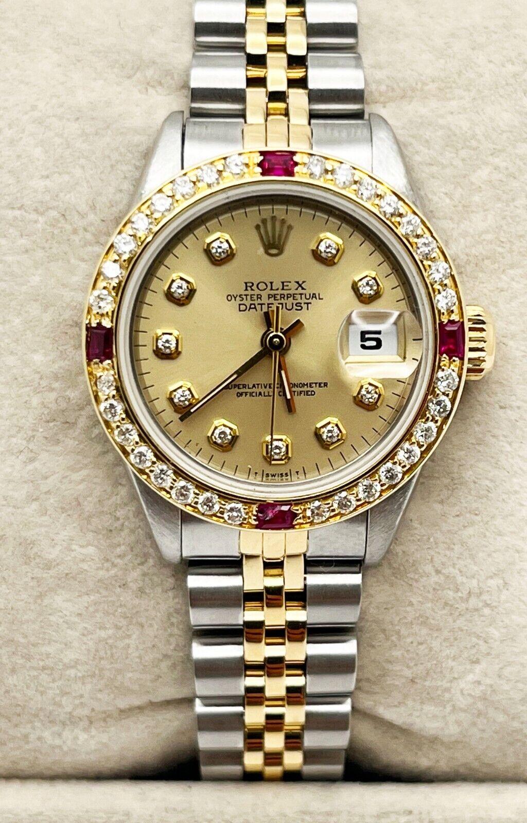 Style Number: 69173

Serial: L816***

Year: 1989
 
Model: Ladies Datejust
 
Case Material: Stainless Steel
 
Band: 18K Yellow Gold & Stainless Steel
 
Bezel: Custom Diamond & Ruby Bezel
 
Dial: Custom Diamond Dial
 
Face: Sapphire Crystal
 
Case