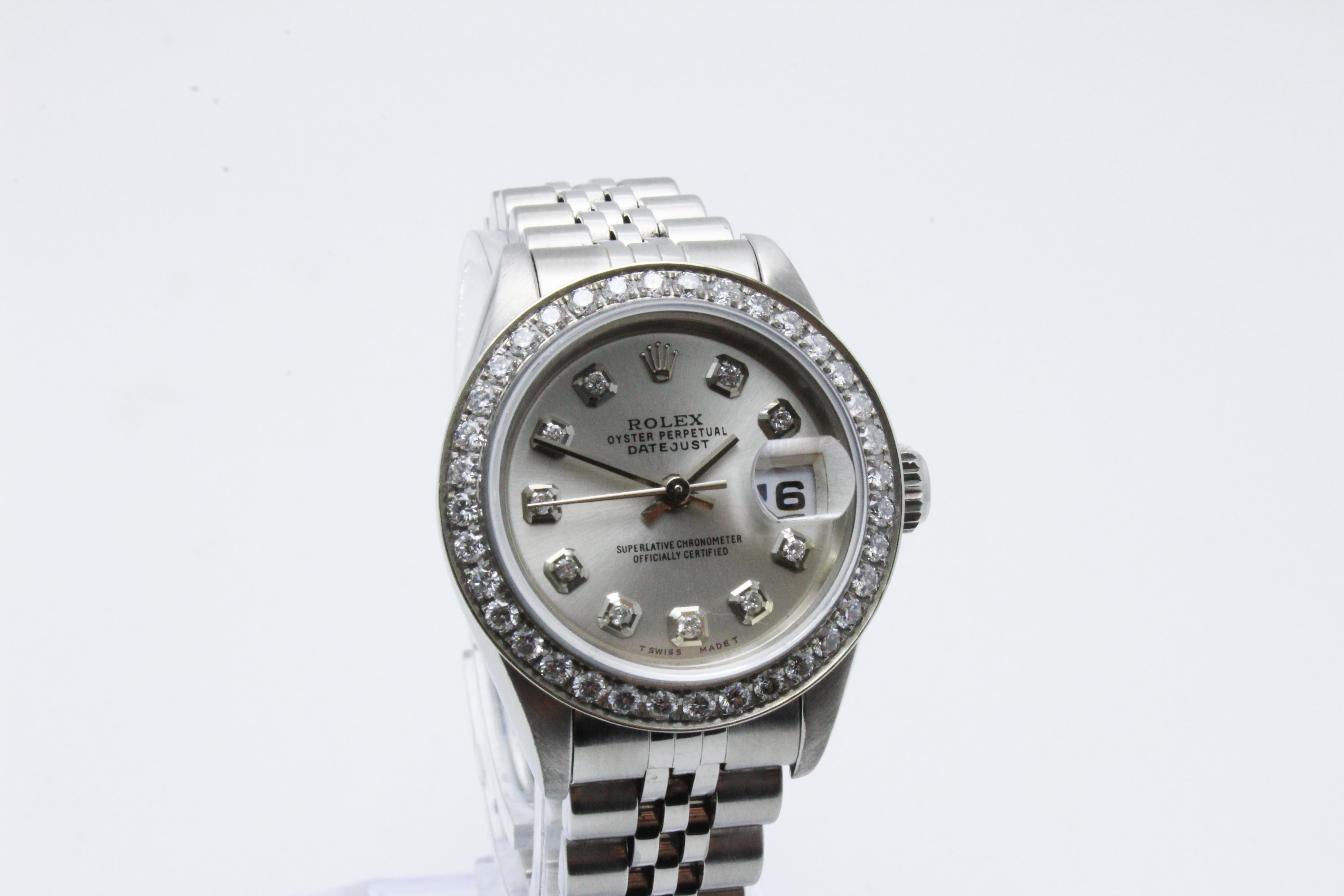 Style Number: 69174

 

Serial: W809***

 

Model: Datejust

 

Case Material: 

 

Band: Stainless Steel

 

Bezel:  Custom Diamond Bezel

 

Dial: Custom Diamond Dial

 

Face: Sapphire Crystal 

 

Case Size: 26mm

 

Includes: 

-Elegant Watch