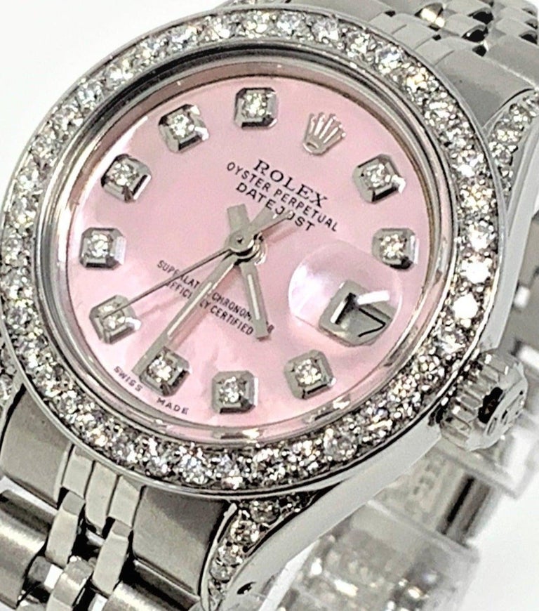 Brand - Rolex
Gender - Ladies
Condition - Pre owned
Model - 6917 datejust 
Metals -  stainless steel 
Case size - 26mm
Bezel - stainless steel diamond
Crystal - sapphire
Movement - automatic caliber 2035 
Dial - Refinished pink MOP diamond
Wrist