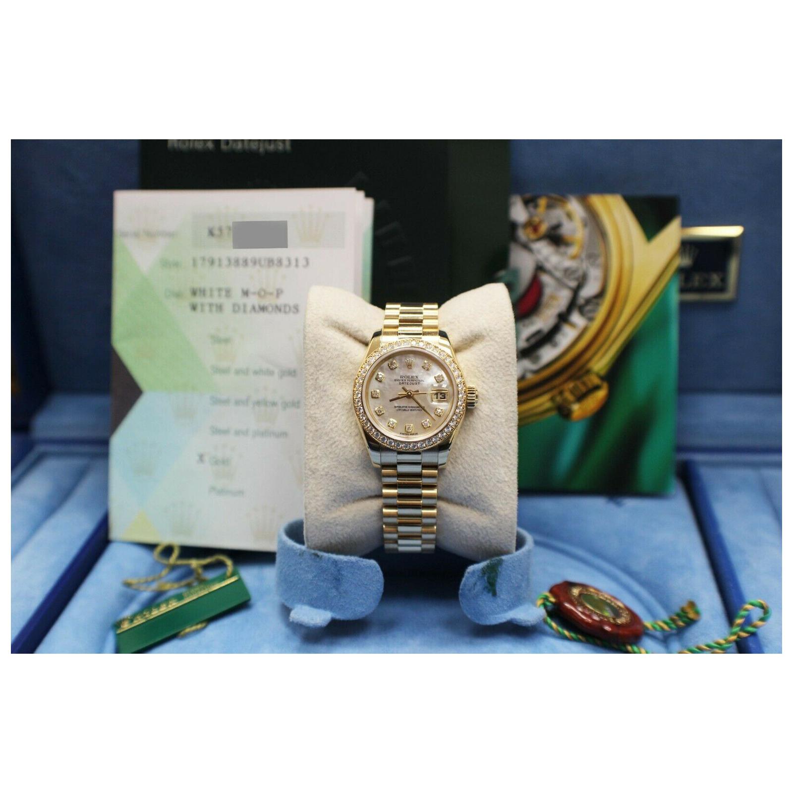 Style Number: 179138
Serial: K571***
Year: 2004
Model: Ladies President Datejust
Case Material: 18K Yellow Gold
Band: 18K Yellow Gold
Bezel: Original Factory Diamond Bezel 
Dial: Original Factory Mother of Pearl Diamond Dial 
Face: Sapphire