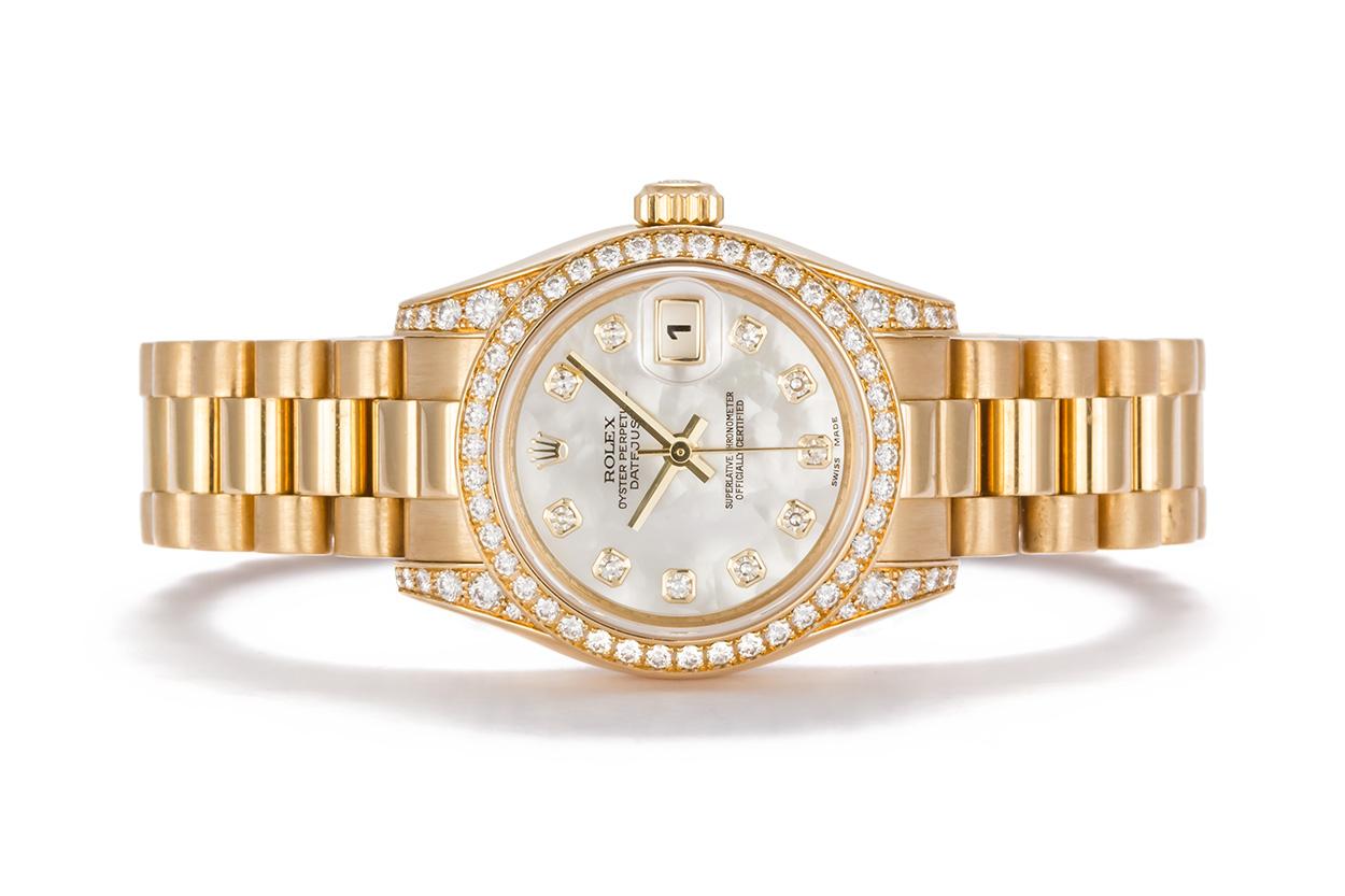 We are pleased to offer this 2006 Rolex 18k Yellow Gold & Diamond Ladies Datejust President 179158. This classic ladies watch features a solid 18k Yellow gold design with factory diamond bezel, factory diamond lugs and a beautiful authentic Rolex